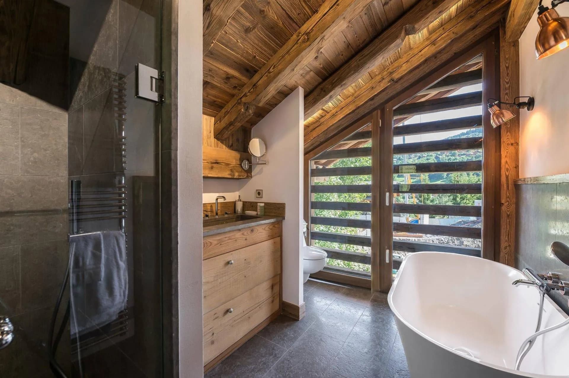 Master en-suite bathroom with a freestanding bath and shower