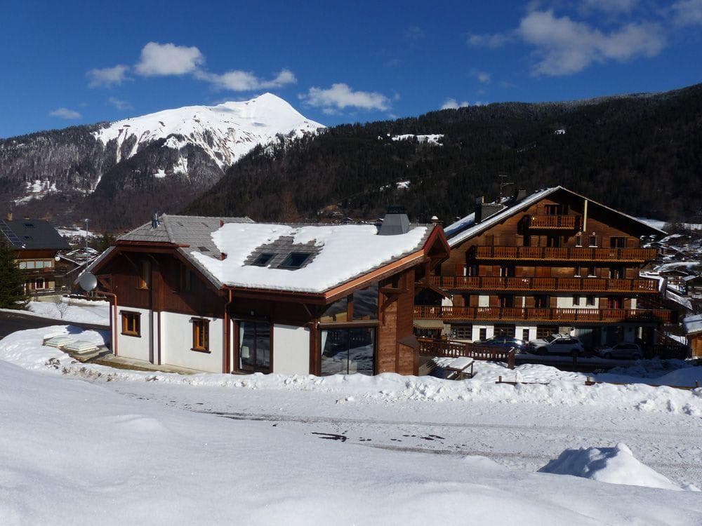 Chalet exterior with mountain views and direct ski-in access