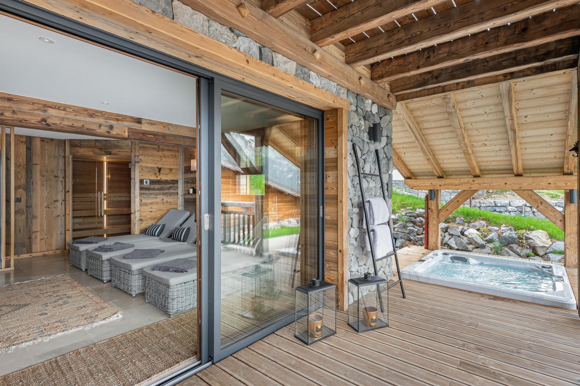 Spa area with indoor loungers, sauna, and covered outdoor hot tub