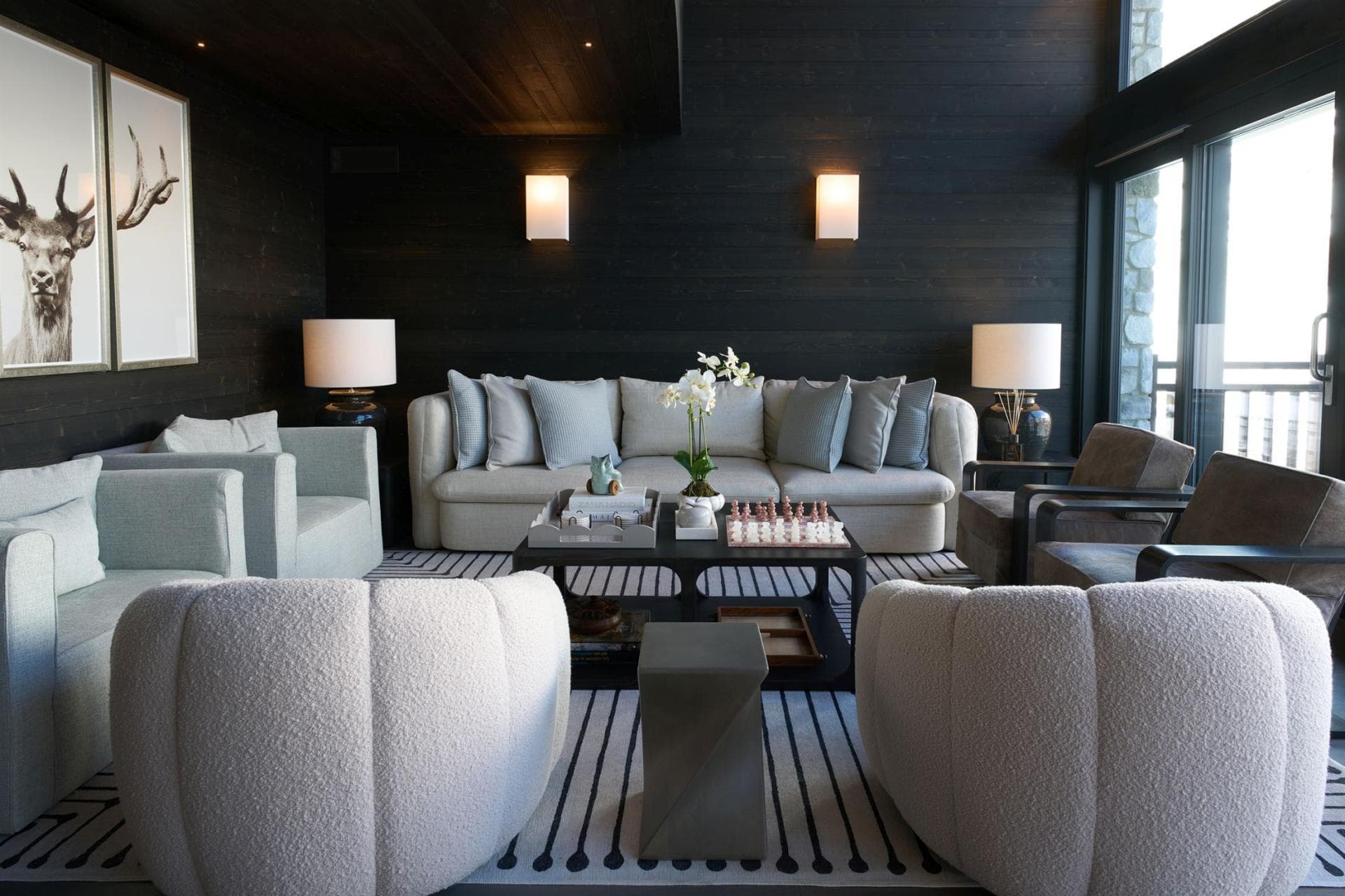 Living area with seating for 7 and floor-to-ceiling balcony doors