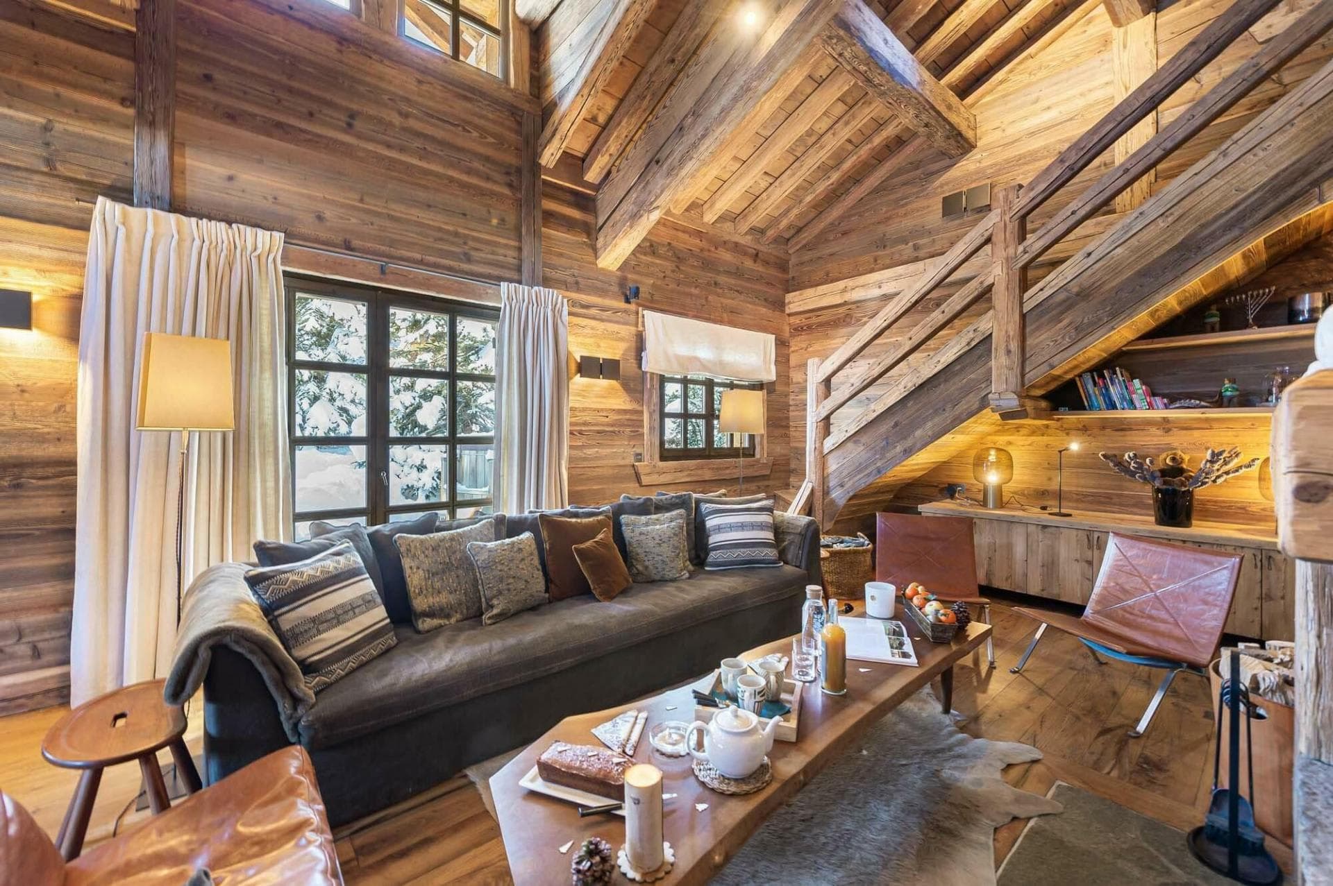 Living room with vaulted timber ceilings and mountain views