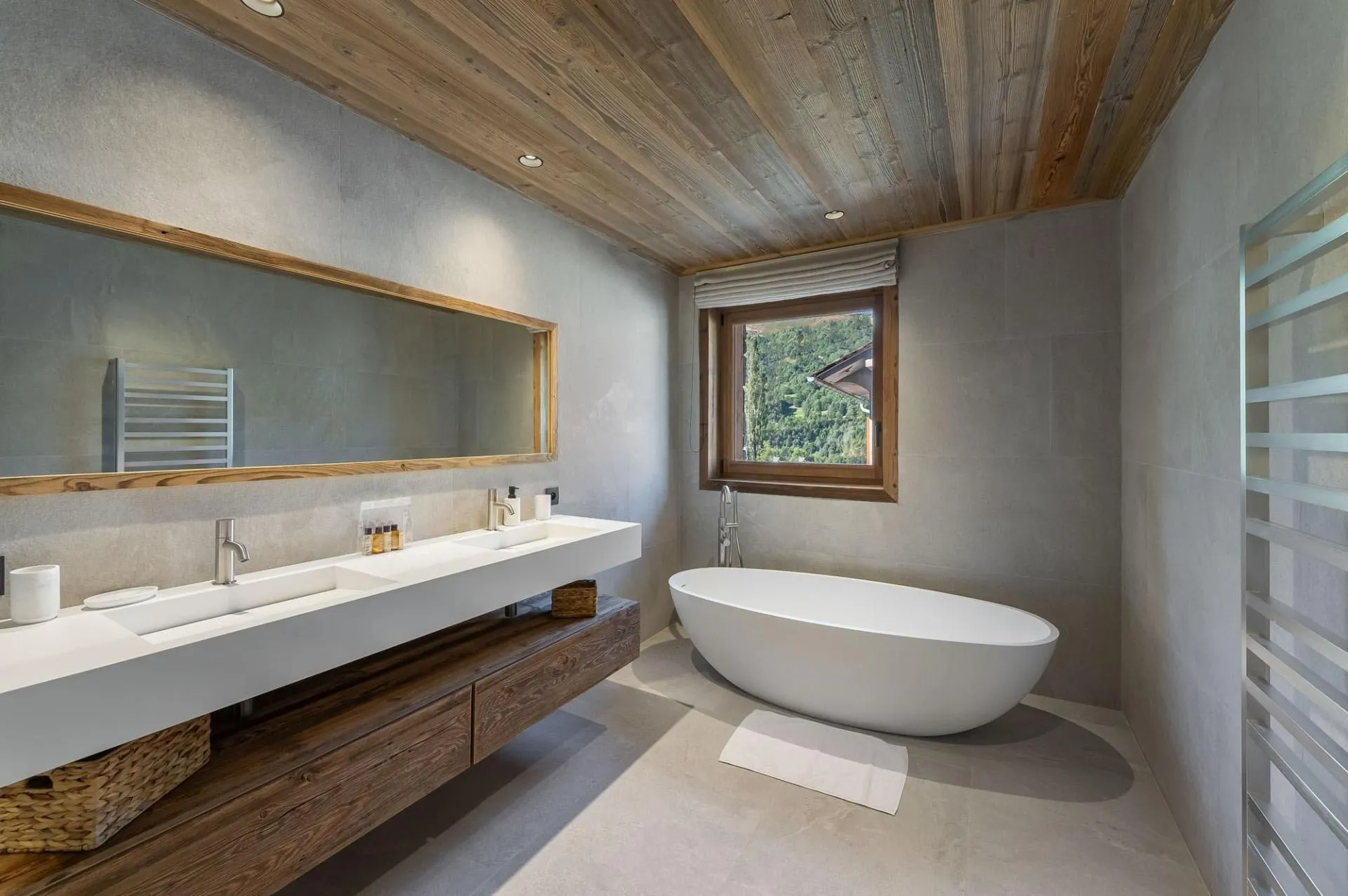 En-suite bathroom with twin basins and a bath