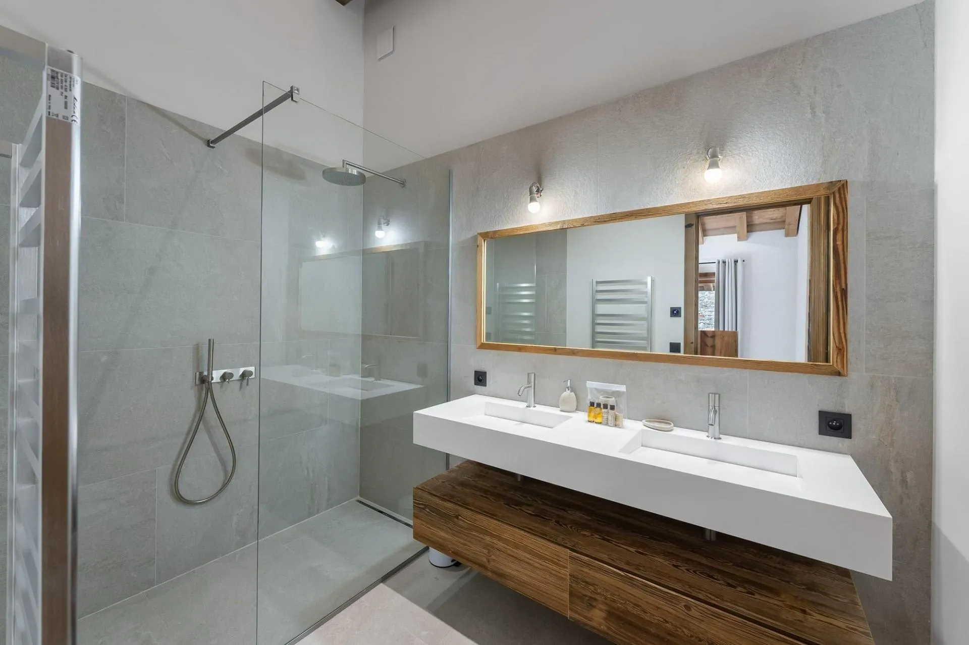 En-suite shower room with twin basins and a walk-in shower