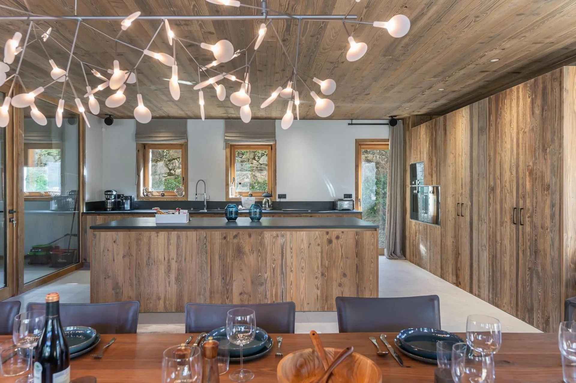 Kitchen with a central island and integrated wall ovens
