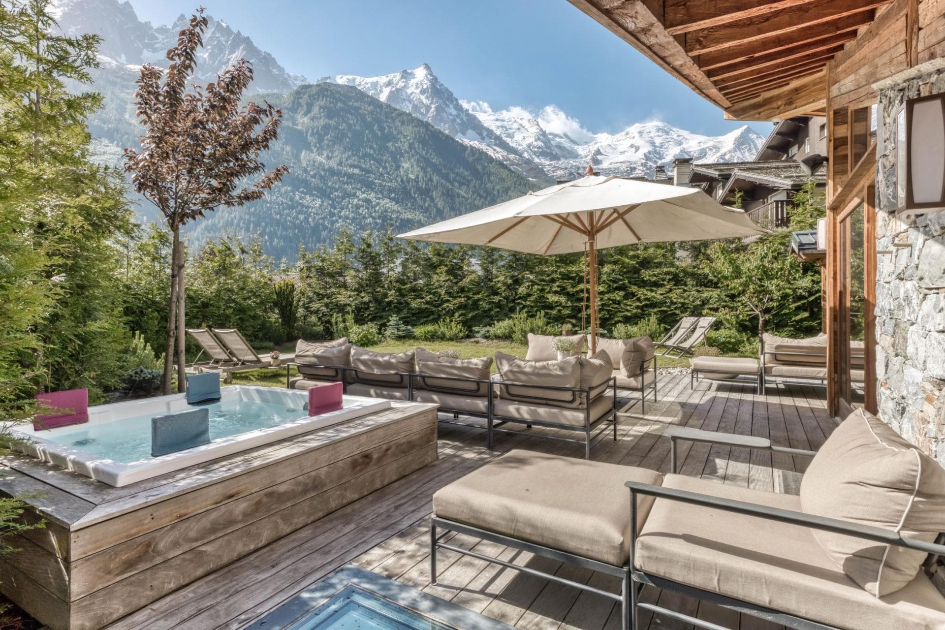 Private deck with hot tub, lounge seating, and Mont Blanc views