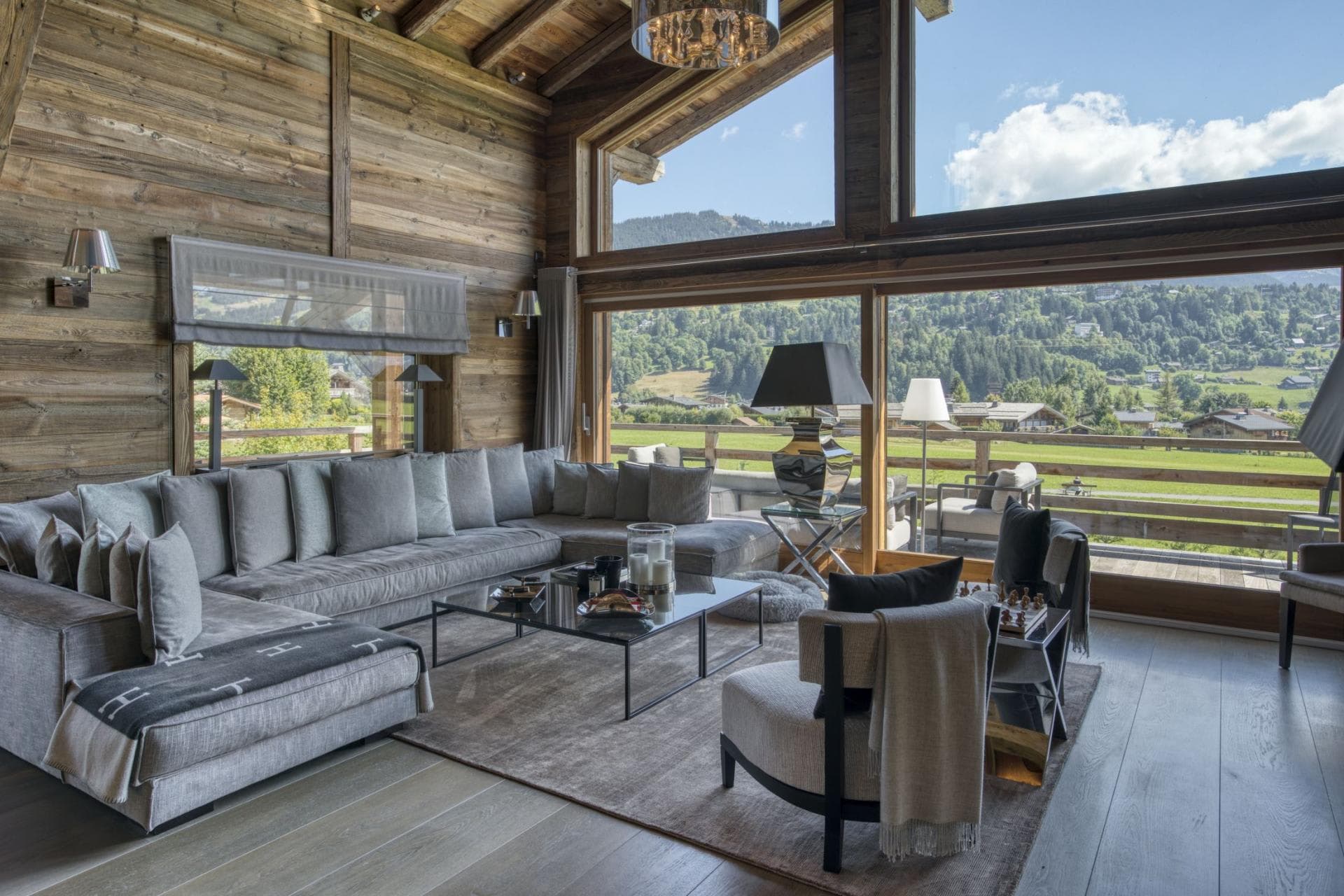 Living area with sectional seating for 10 and alpine valley views