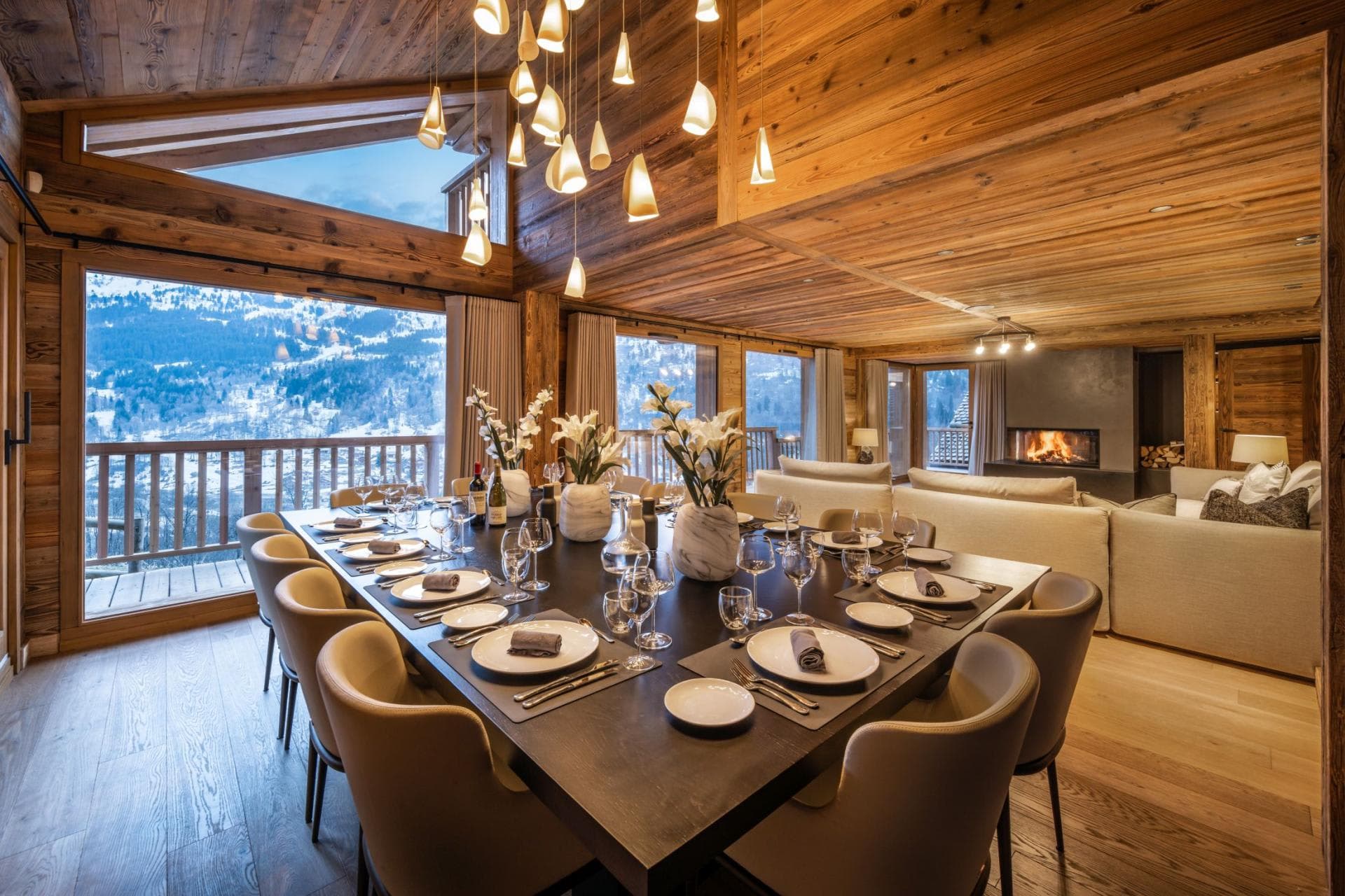 Open-plan dining area with seating for 12 and valley views