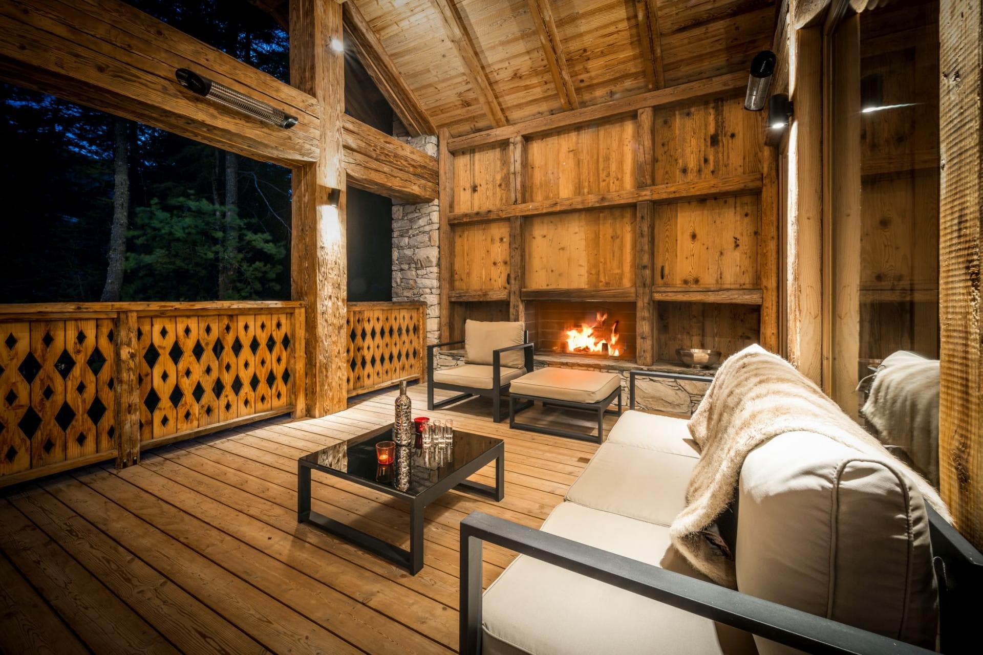 Covered deck with wood-burning fireplace and overhead heaters