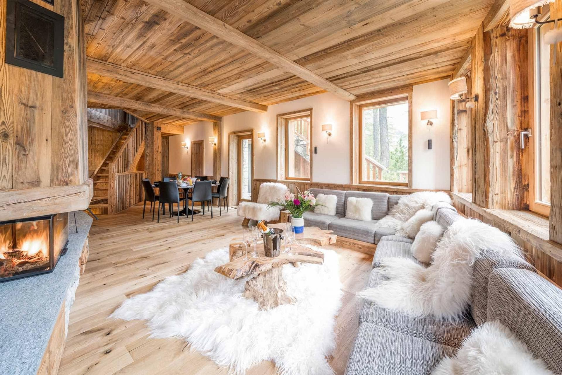 Open living area with wood-burning fireplace and dining seating for 6