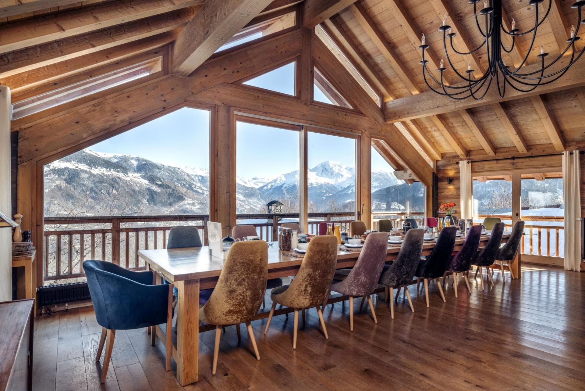 Dining area seats 14 with mountain views and vaulted timber ceilings