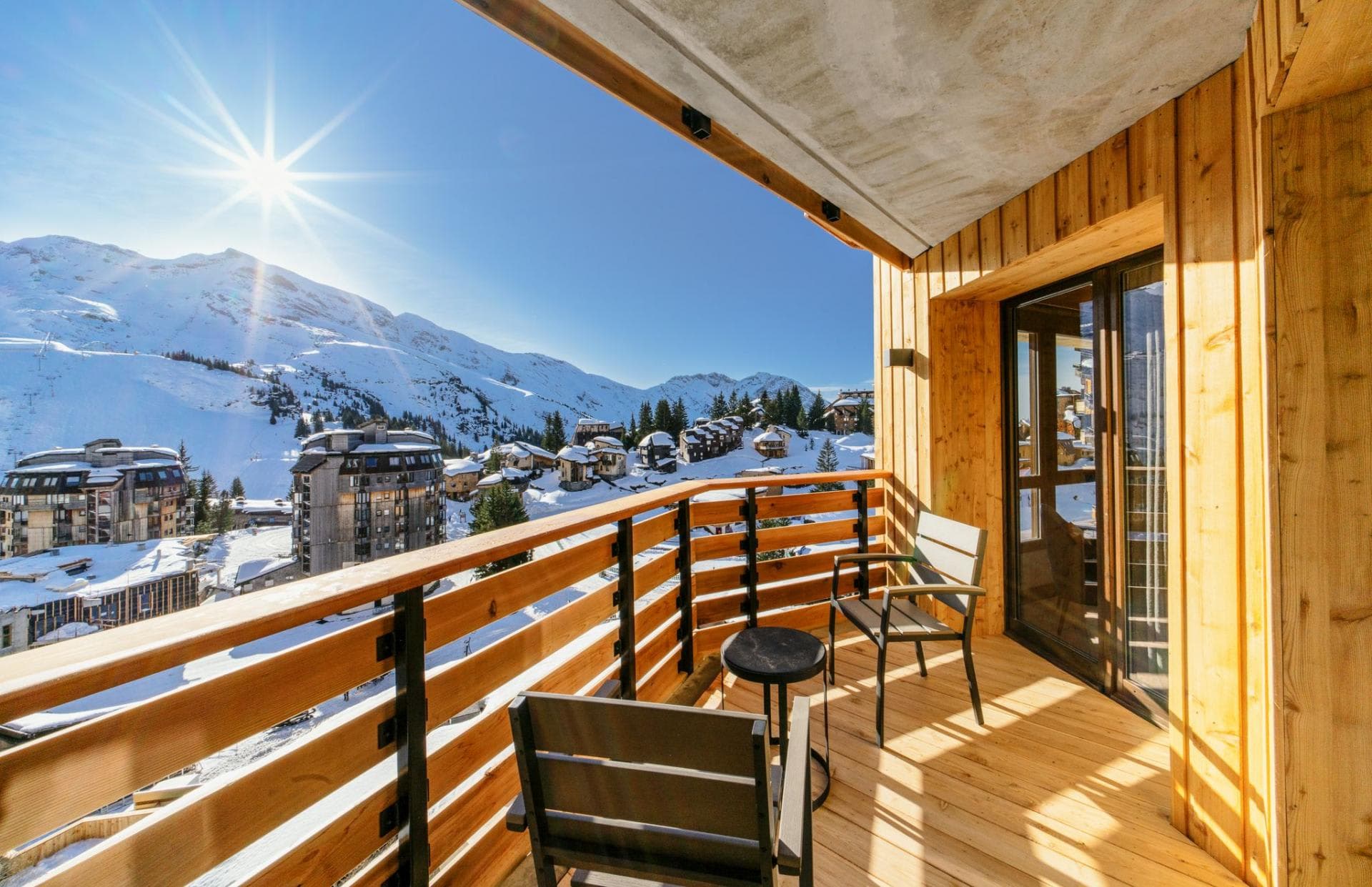 Private balcony with seating; panoramic views of ski slopes and resort