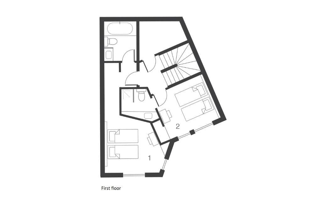 First floor layout: two twin bedrooms and two full bathrooms