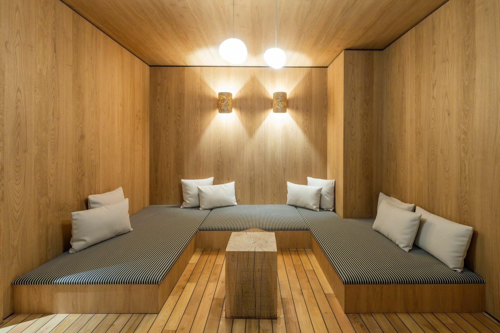 Sauna with bench seating for 6; heated wood interior with ambient lighting