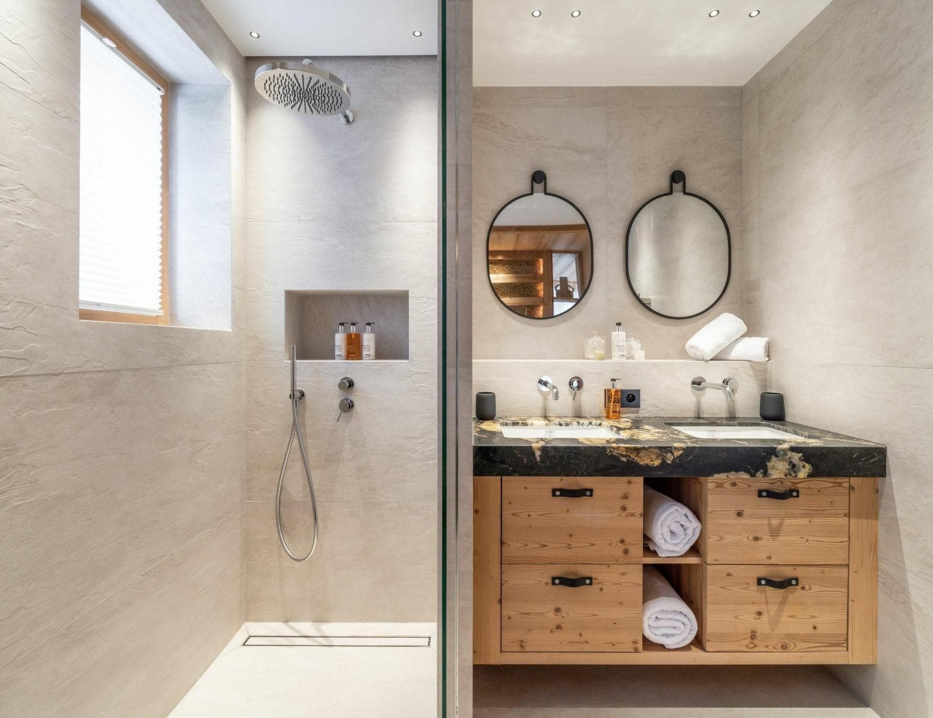Bathroom with dual vanity and walk-in rain shower