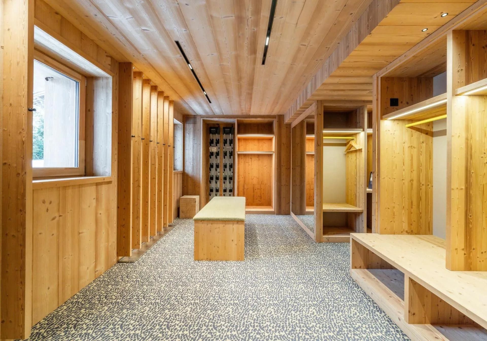 Ski room with bench seating, storage and boot warmers