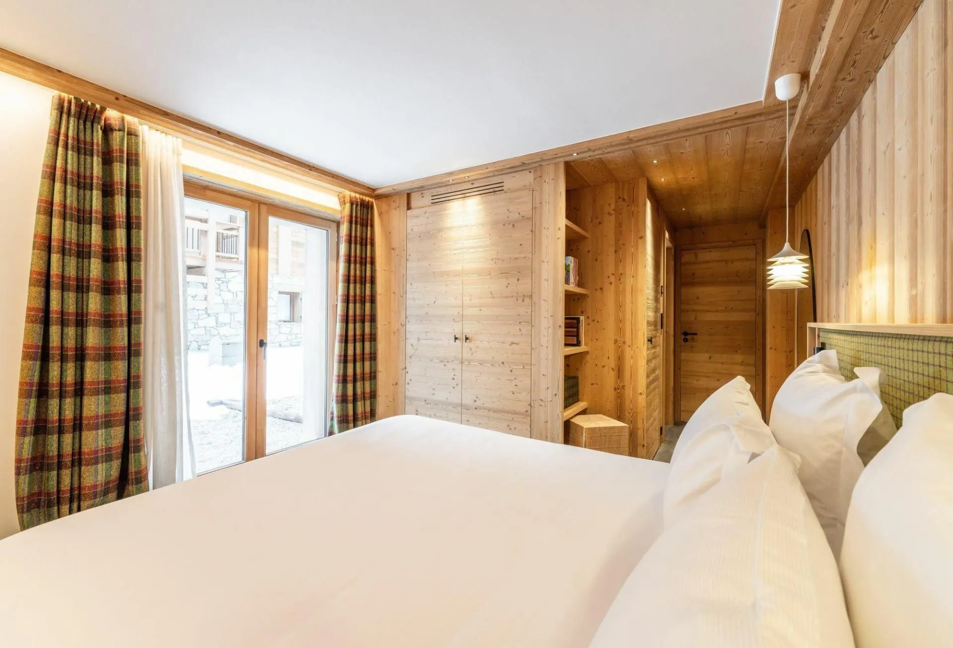 Ground-floor double bedroom with terrace doors and built-in storage
