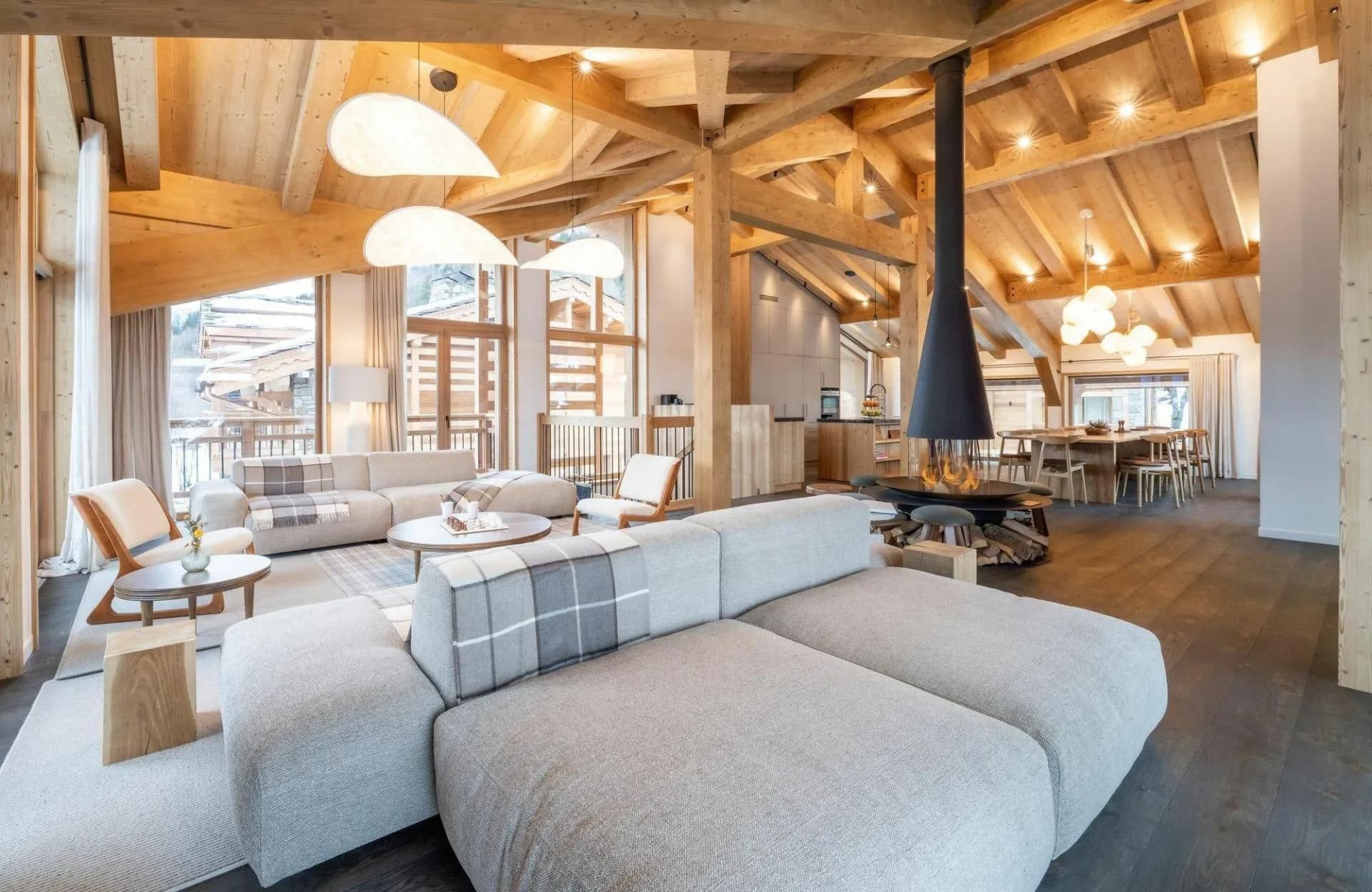 Open-plan living space with central fireplace and lounge seating