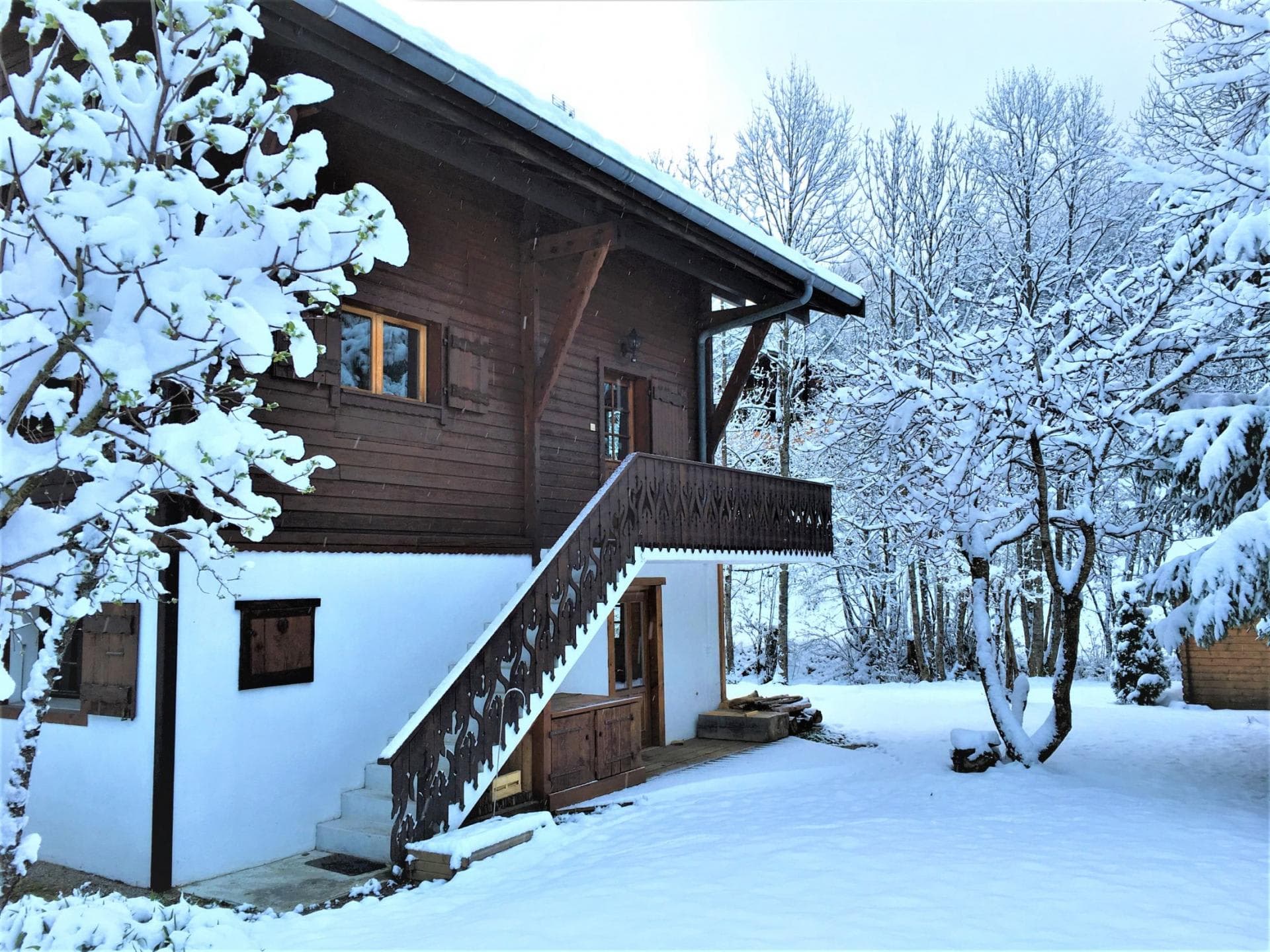 Chalet exterior with separate ground floor entrance and upper level balcony