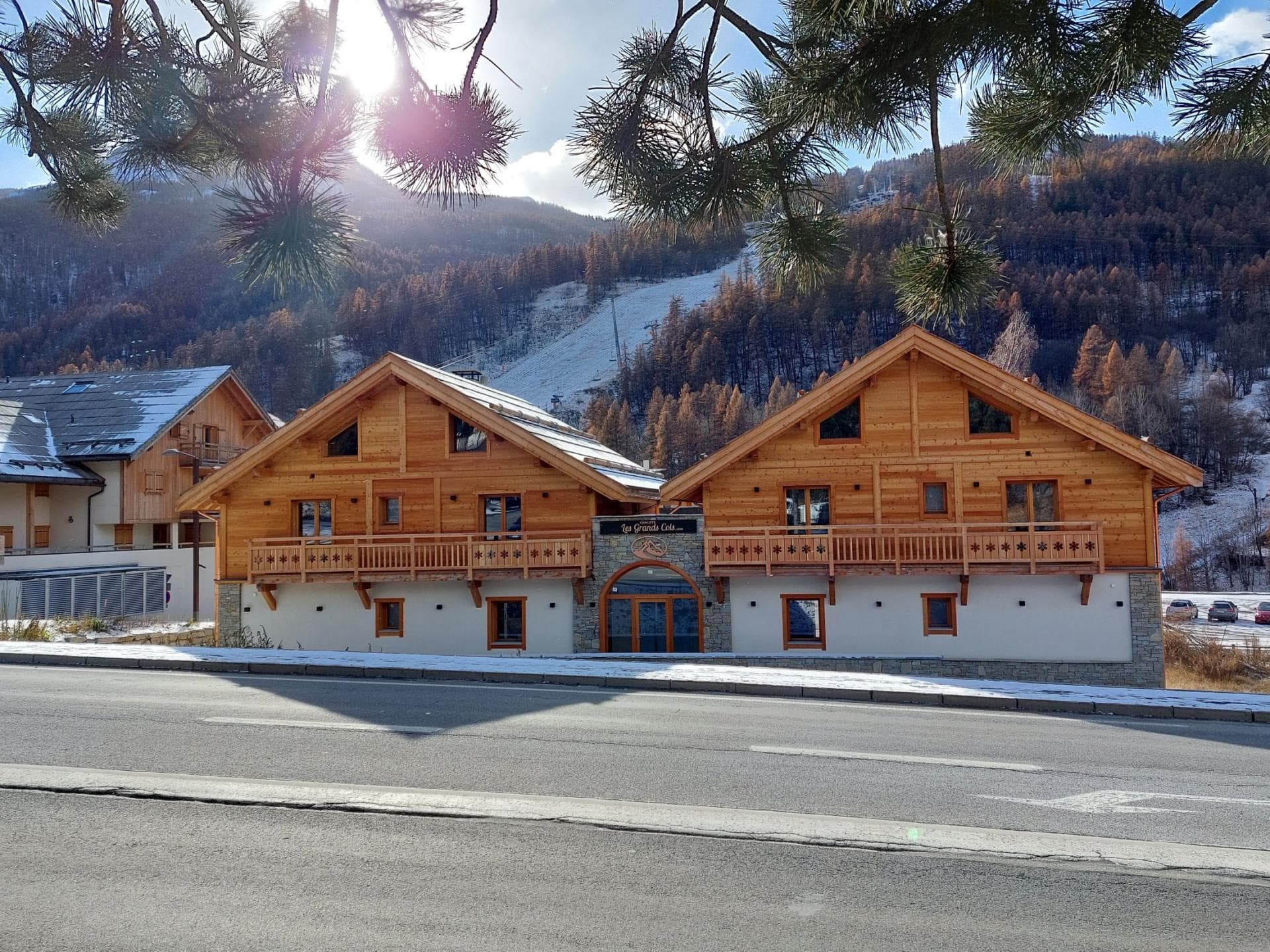 Chalet exterior with timber balconies and direct views of ski slopes