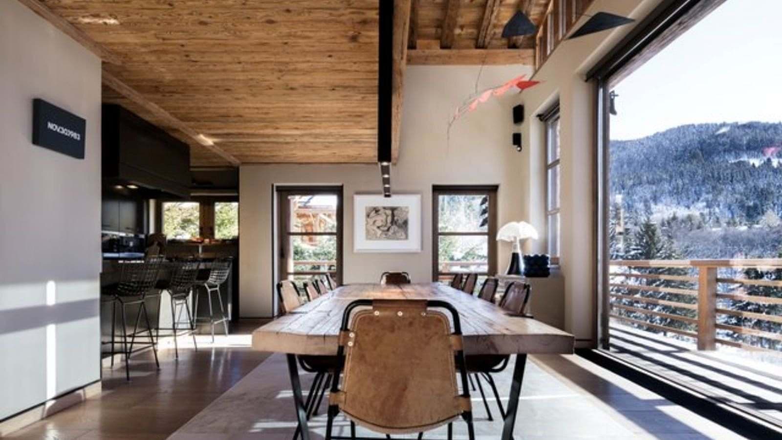 Dining table with seating for 10; mountain views and balcony access