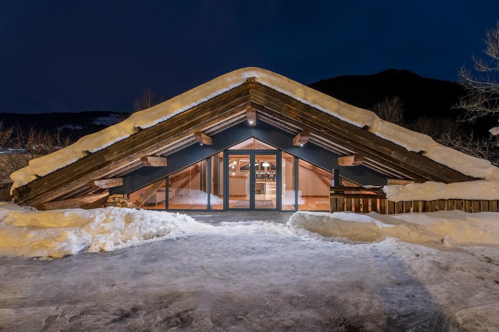 Chalet entrance with heated driveway and exposed timber eaves