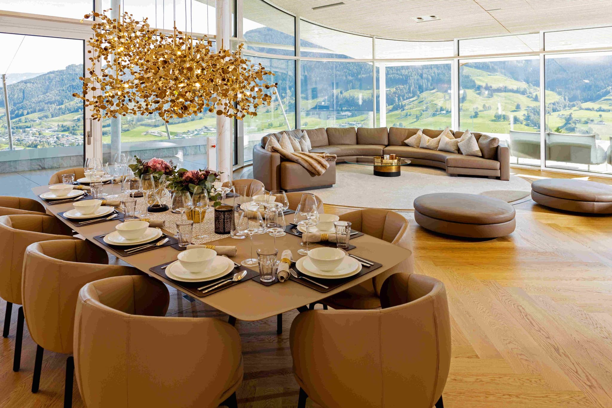 Dining table seats 10; floor-to-ceiling windows with panoramic mountain views