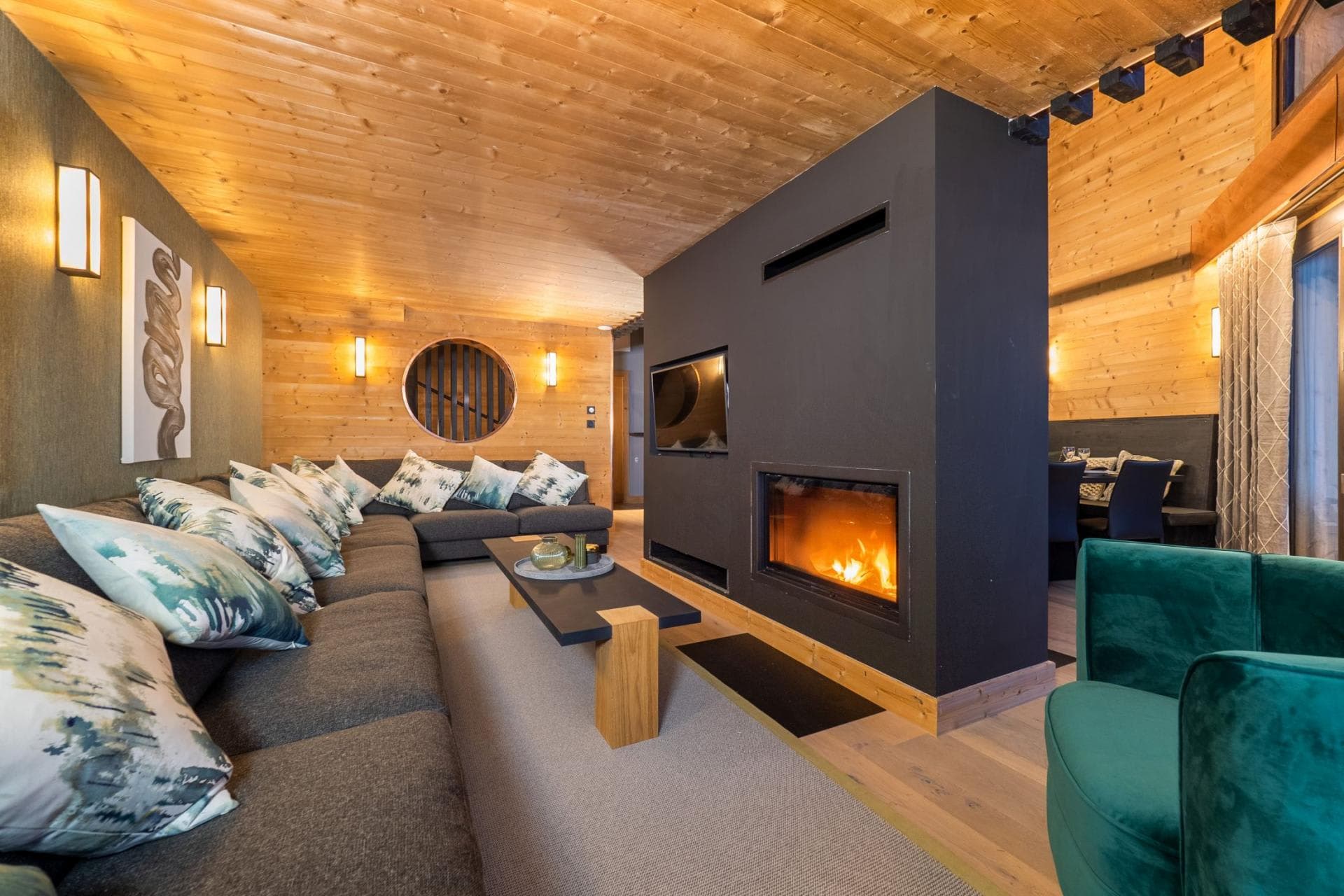 Living room with wood-burning fireplace and sectional seating for 10