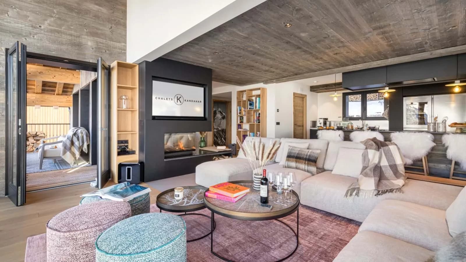 Living room with central fireplace and broad windows