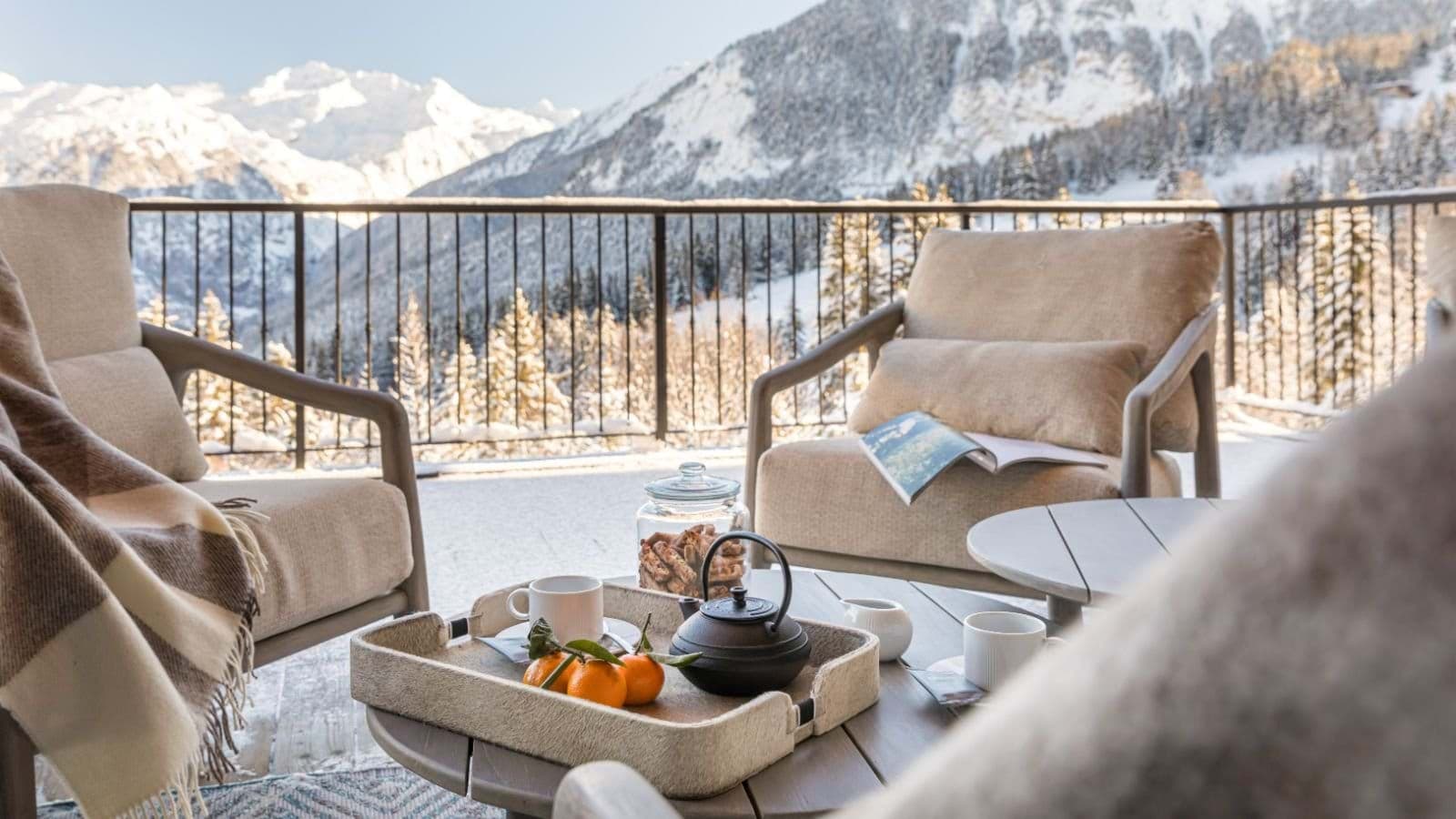 Balcony with lounge seating and alpine mountain views