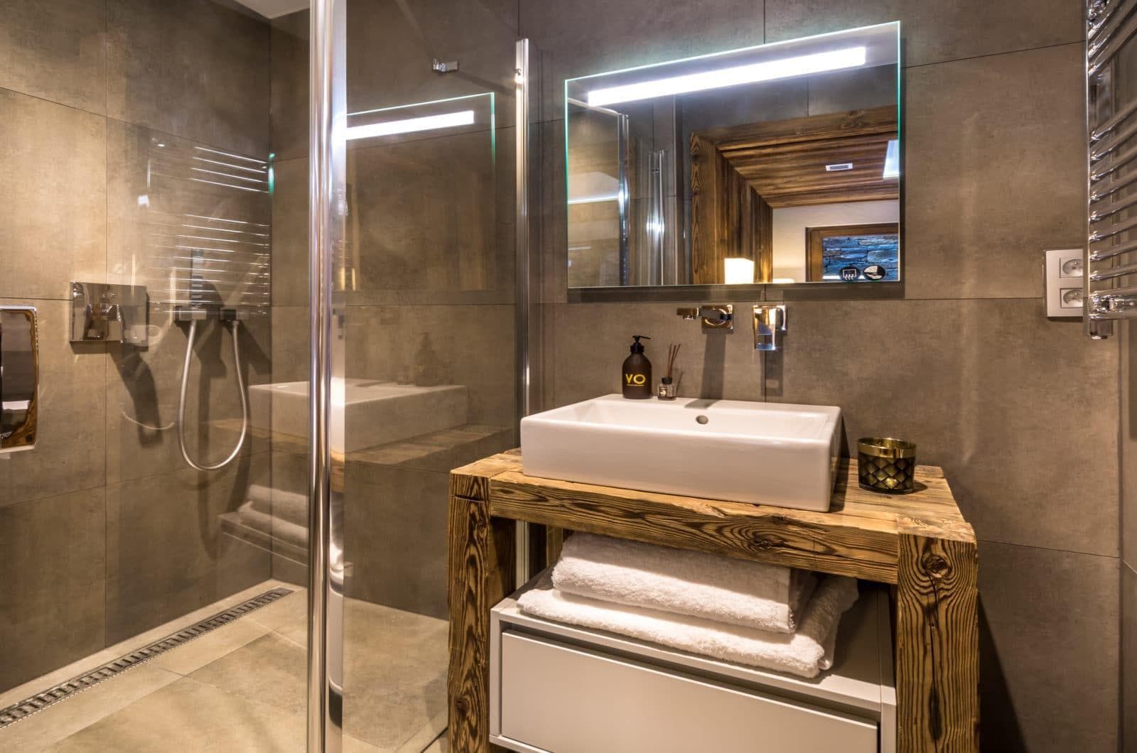Bathroom featuring walk-in rainfall shower and heated towel rail