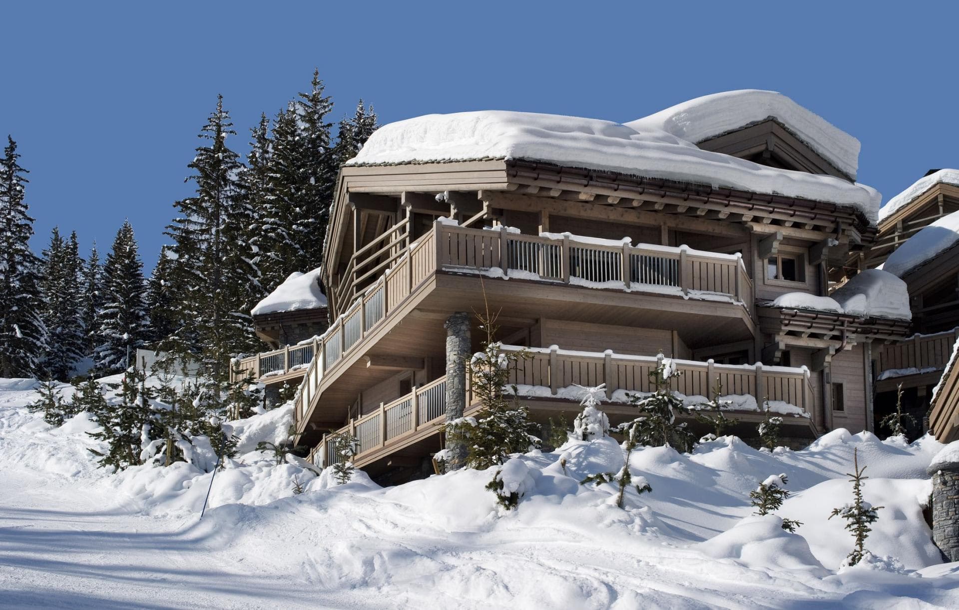 Ski-in, ski-out timber chalet with wrap-around balconies