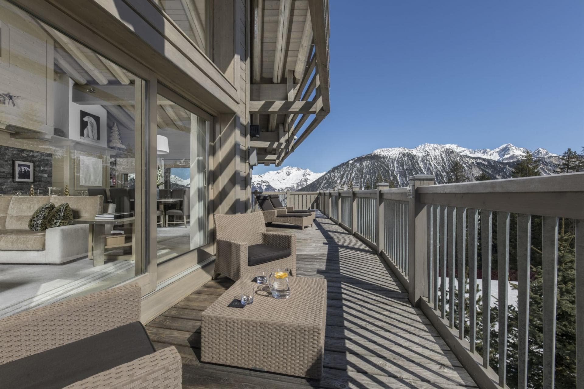 Private balcony with lounge seating and panoramic mountain views