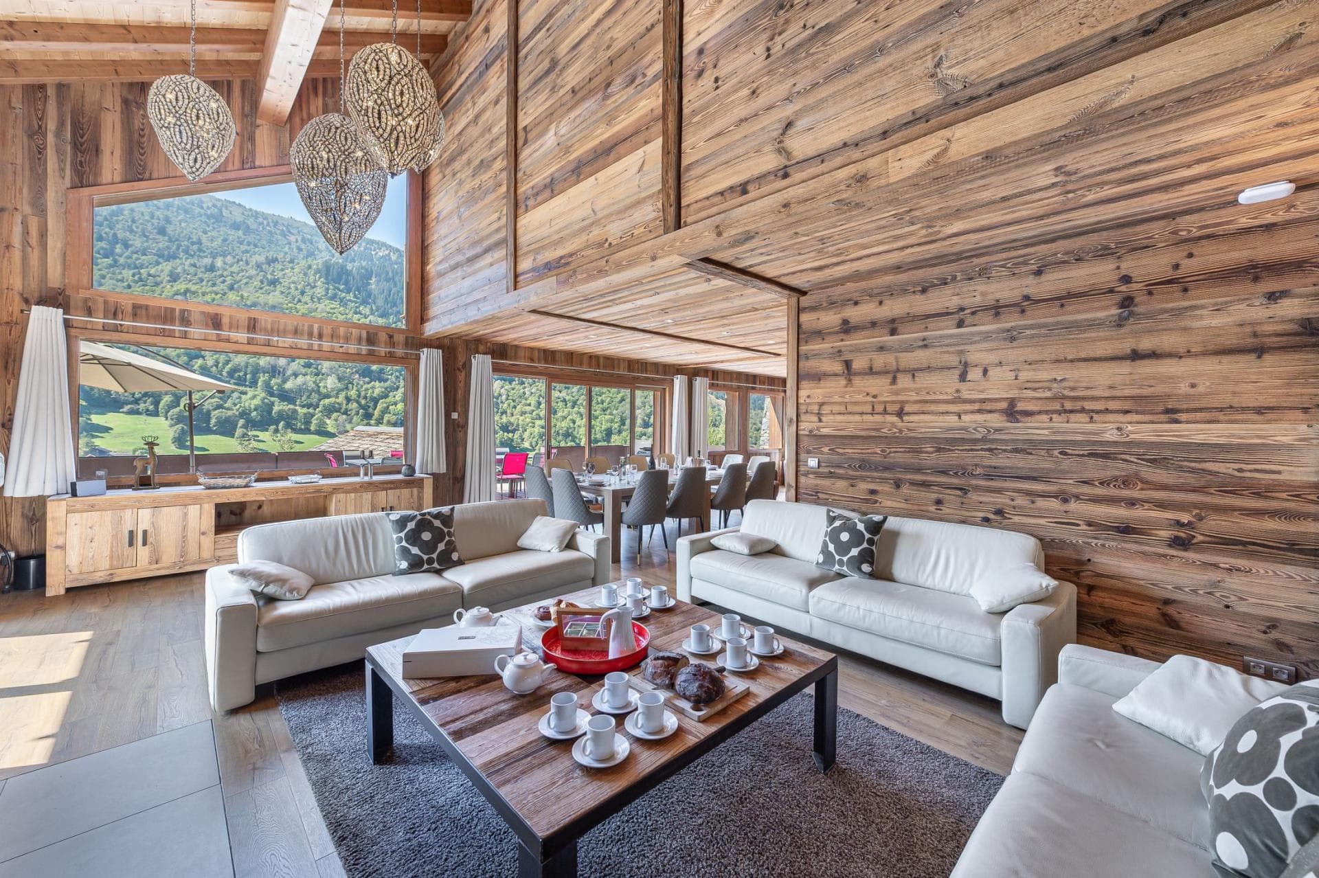 Open-plan living area with vaulted ceilings and dining seating for 10