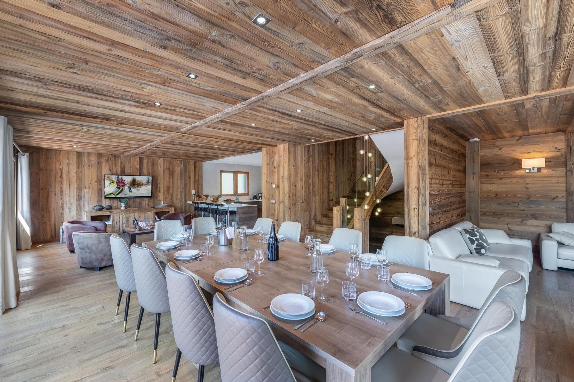 Open-plan dining area with seating for 10 near kitchen and lounge