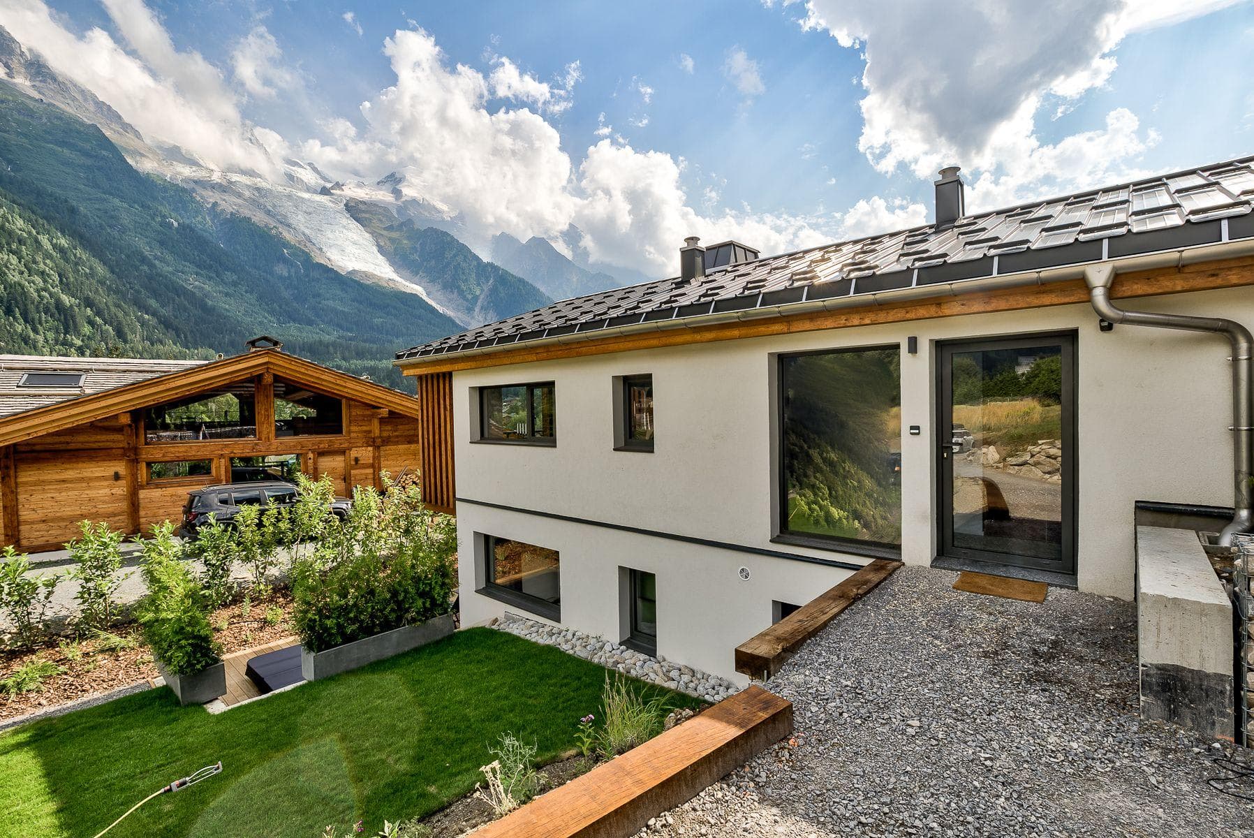 Chalet entrance and tiered garden with views of the Bossons Glacier