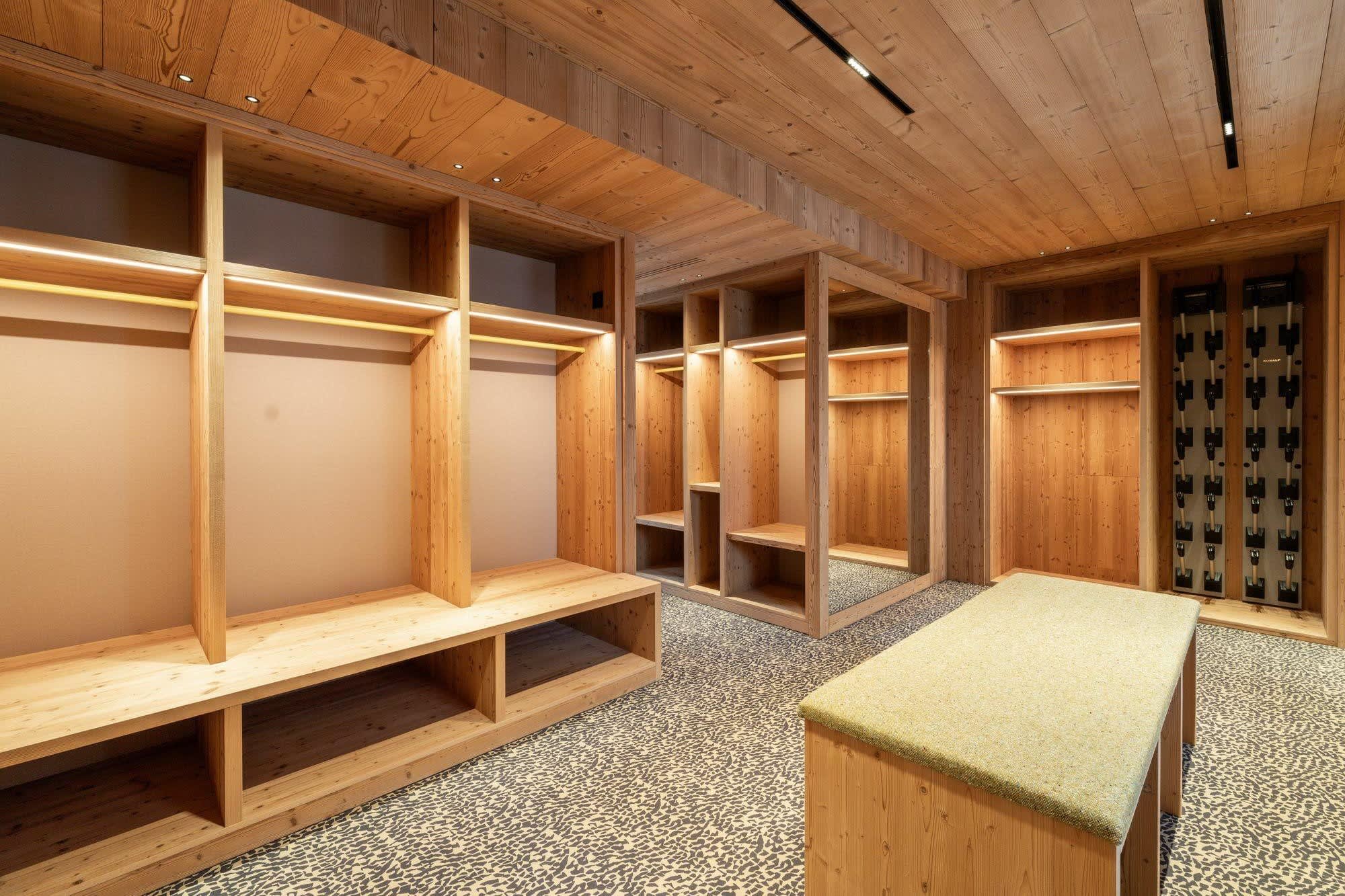 Ski room with heated boot racks and integrated equipment storage