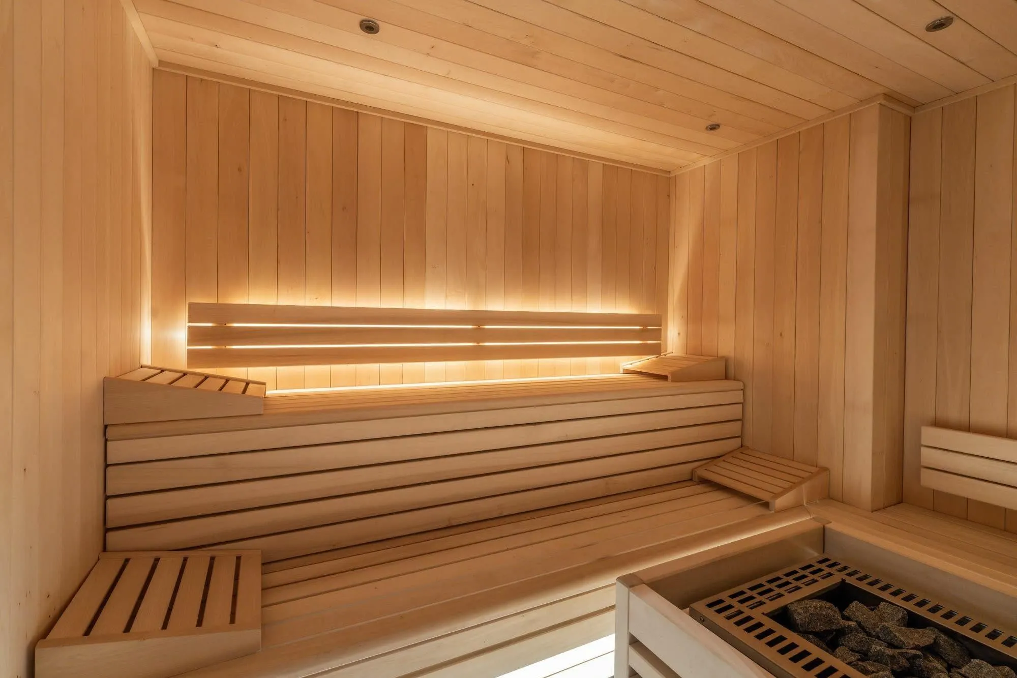 Wood-panelled Norwegian sauna with tiered seating