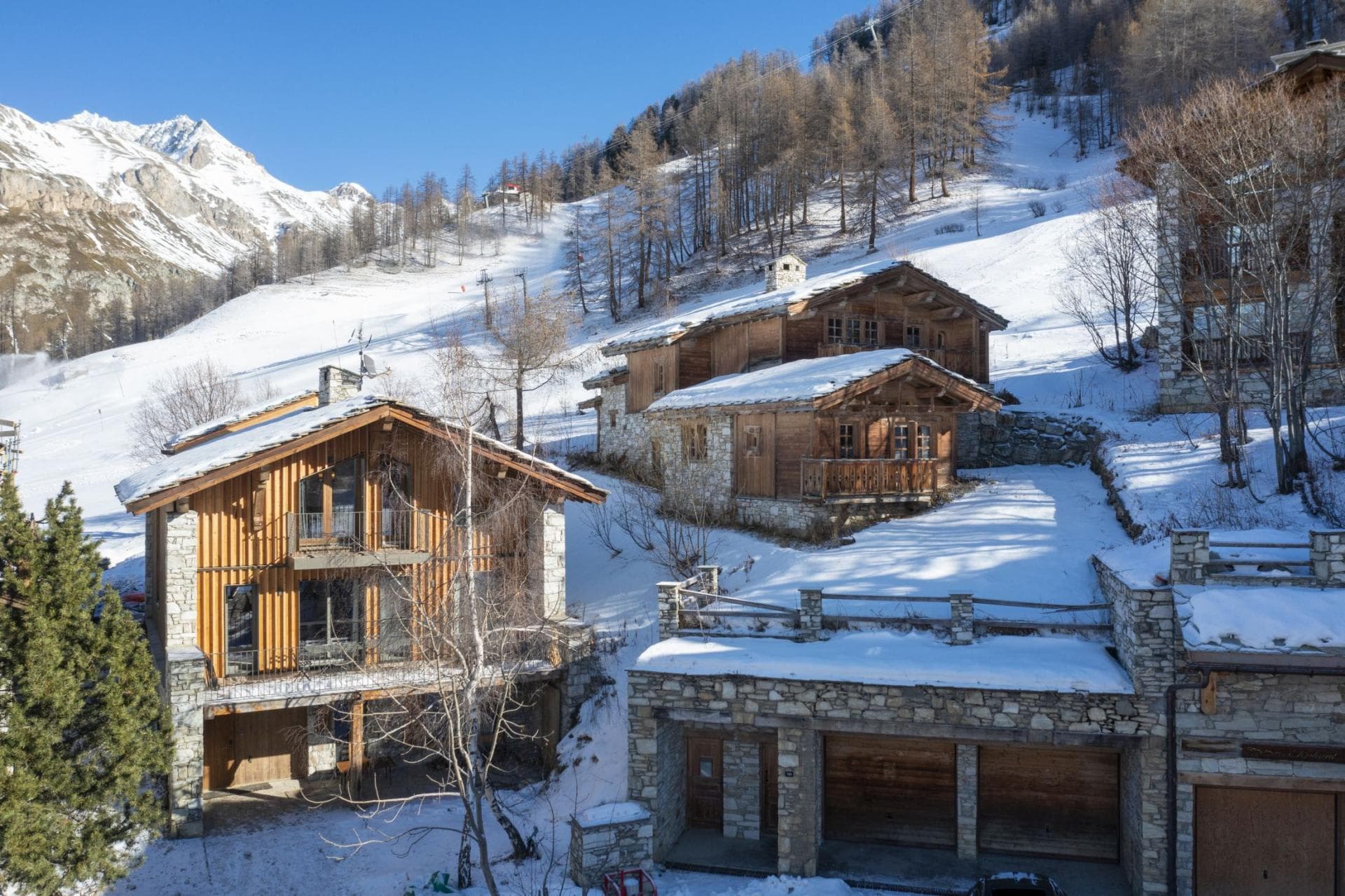 Ski-in/ski-out mountain chalets with private garages and direct slope access