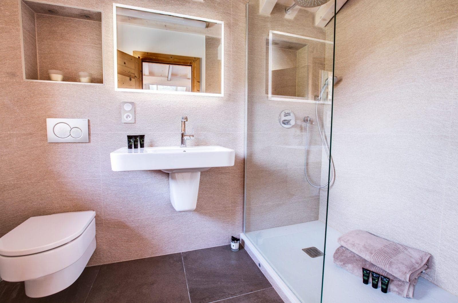 Bathroom with walk-in glass shower and rain showerhead
