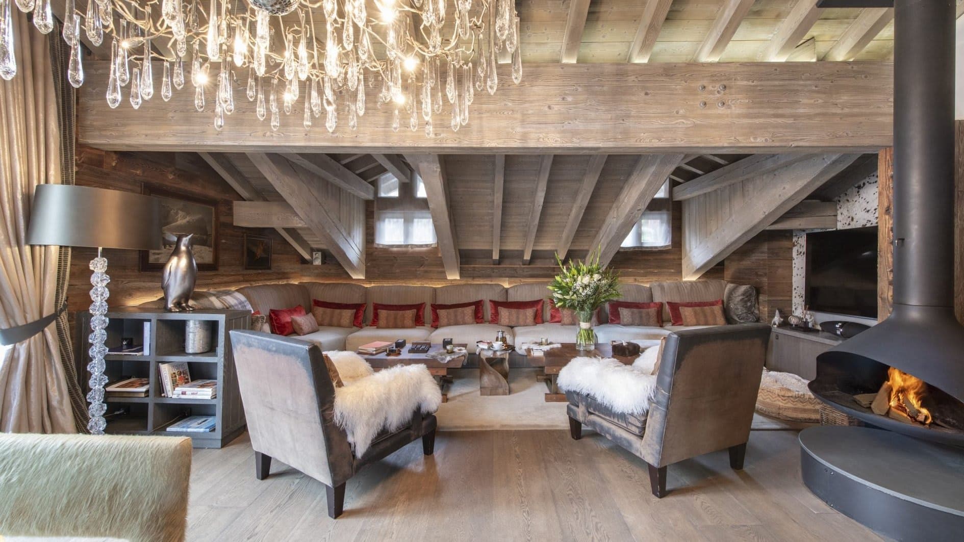 Living area with wood-burning fireplace and sectional seating for 10