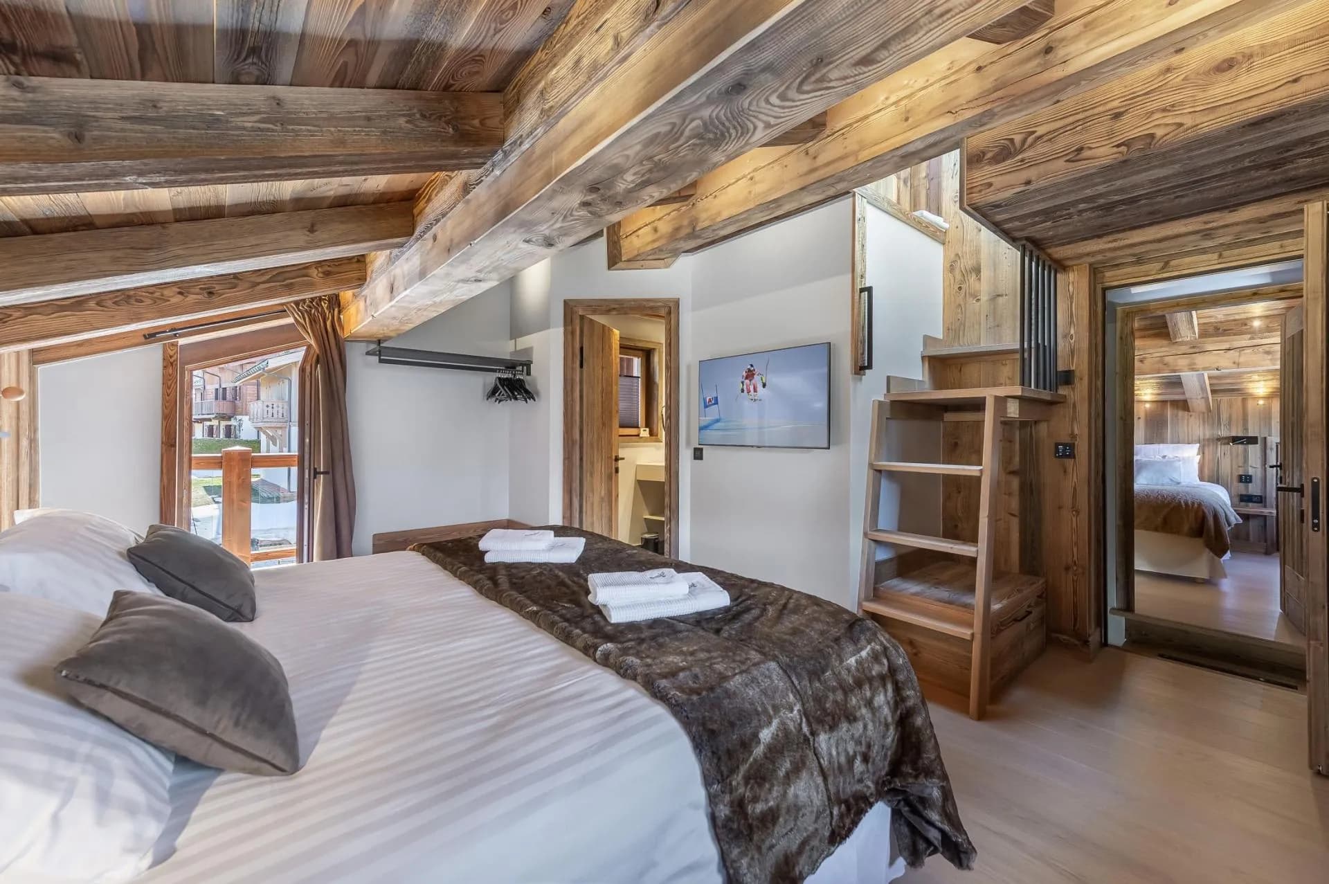 Family bedroom with mezzanine bed and adjoining en-suite shower room
