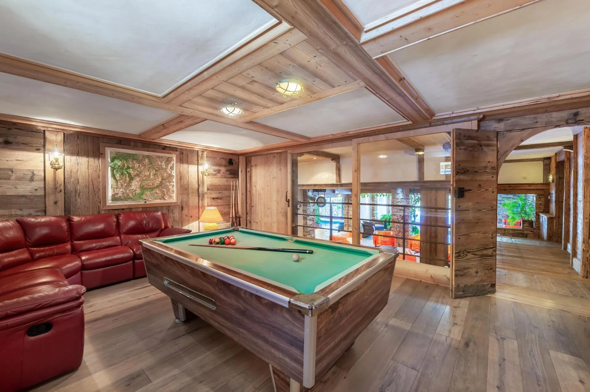 Billiards room with pool table and lounge seating