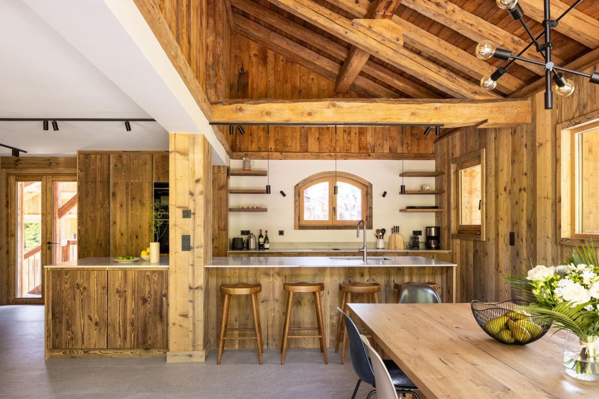 Kitchen with vaulted timber ceiling and breakfast bar seating for 4