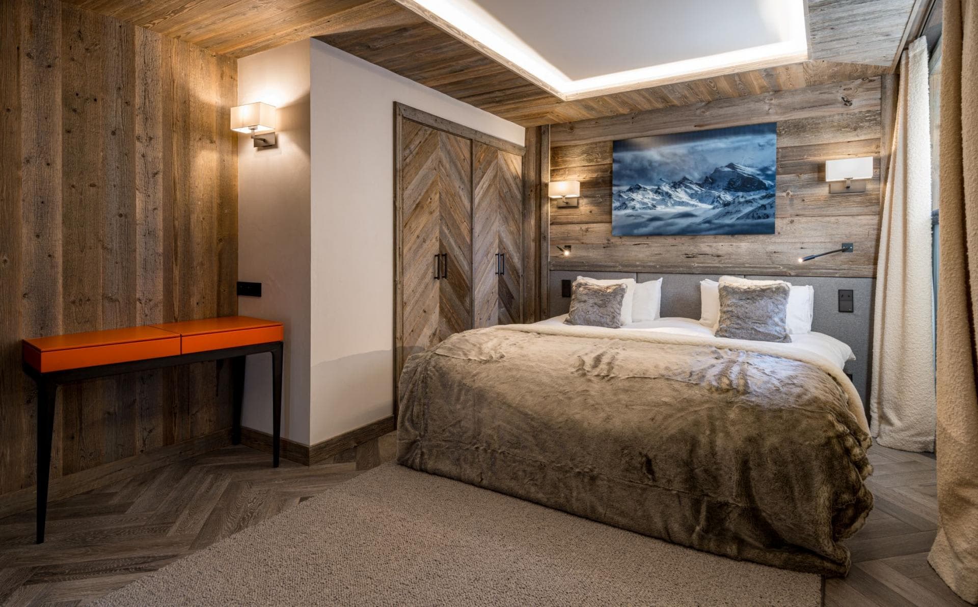 Bedroom with king bed, built-in wardrobe, and dedicated workspace