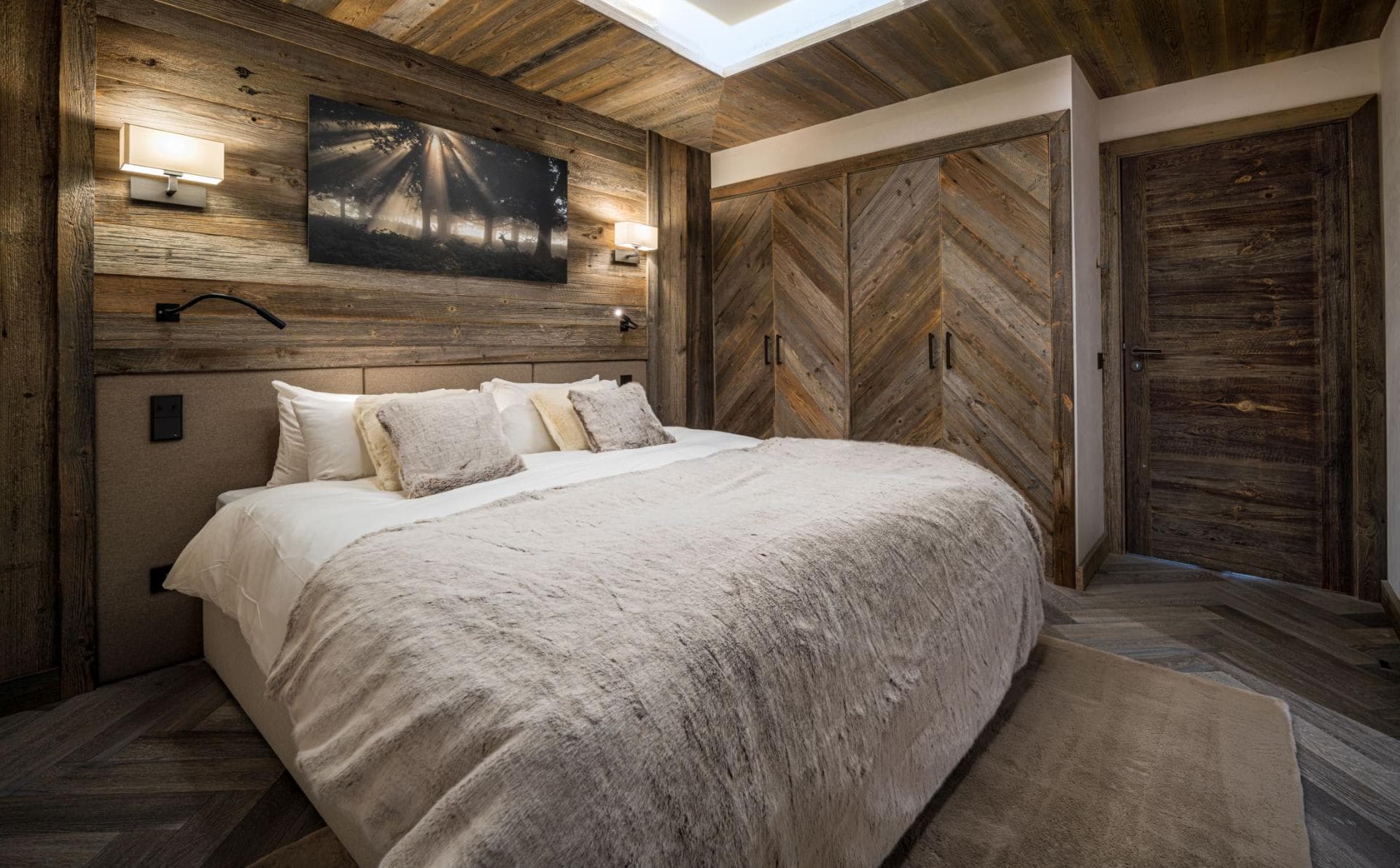Guest bedroom with king bed and built-in reclaimed wood wardrobes