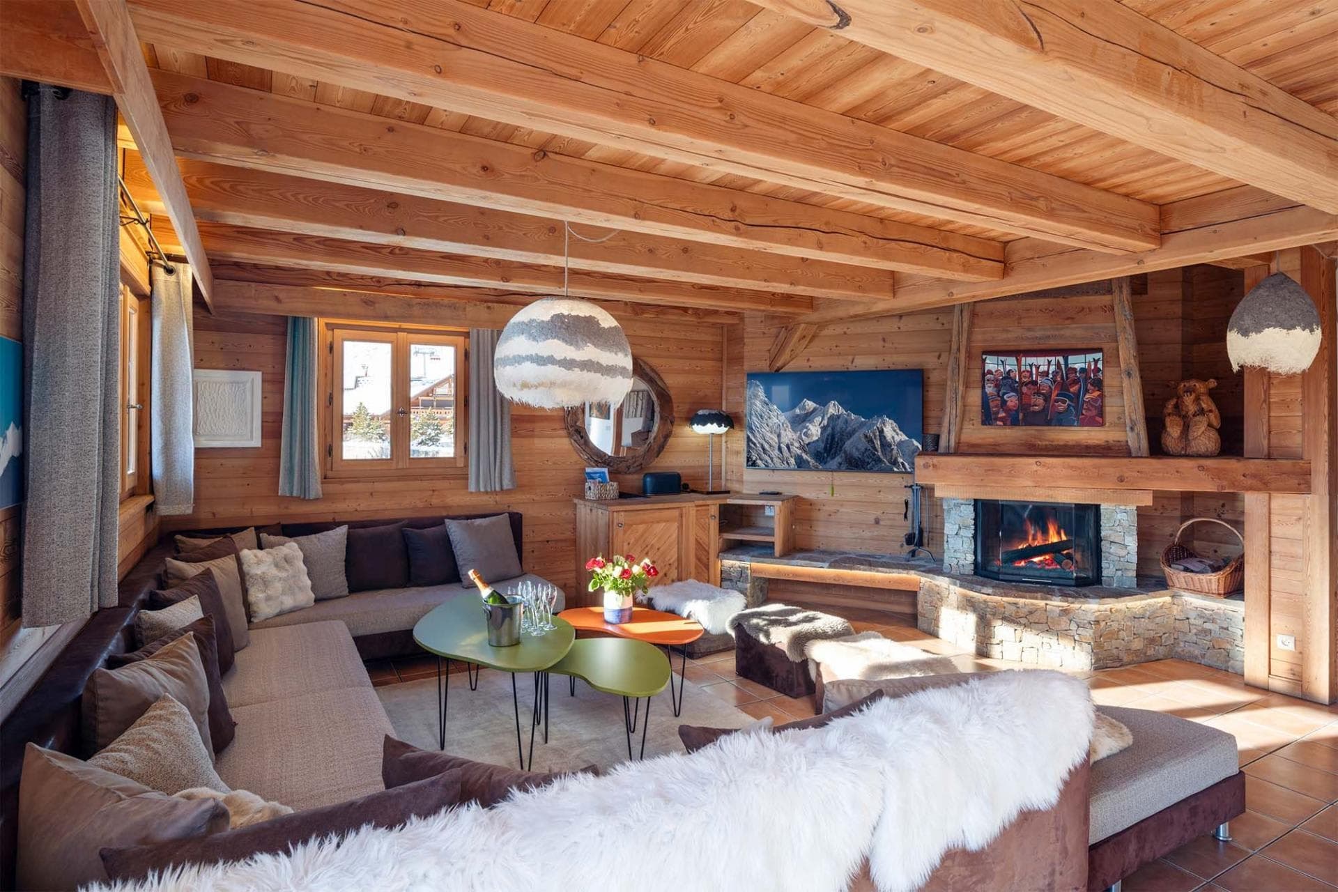 Living area with wood-burning fireplace and large sectional seating for 10