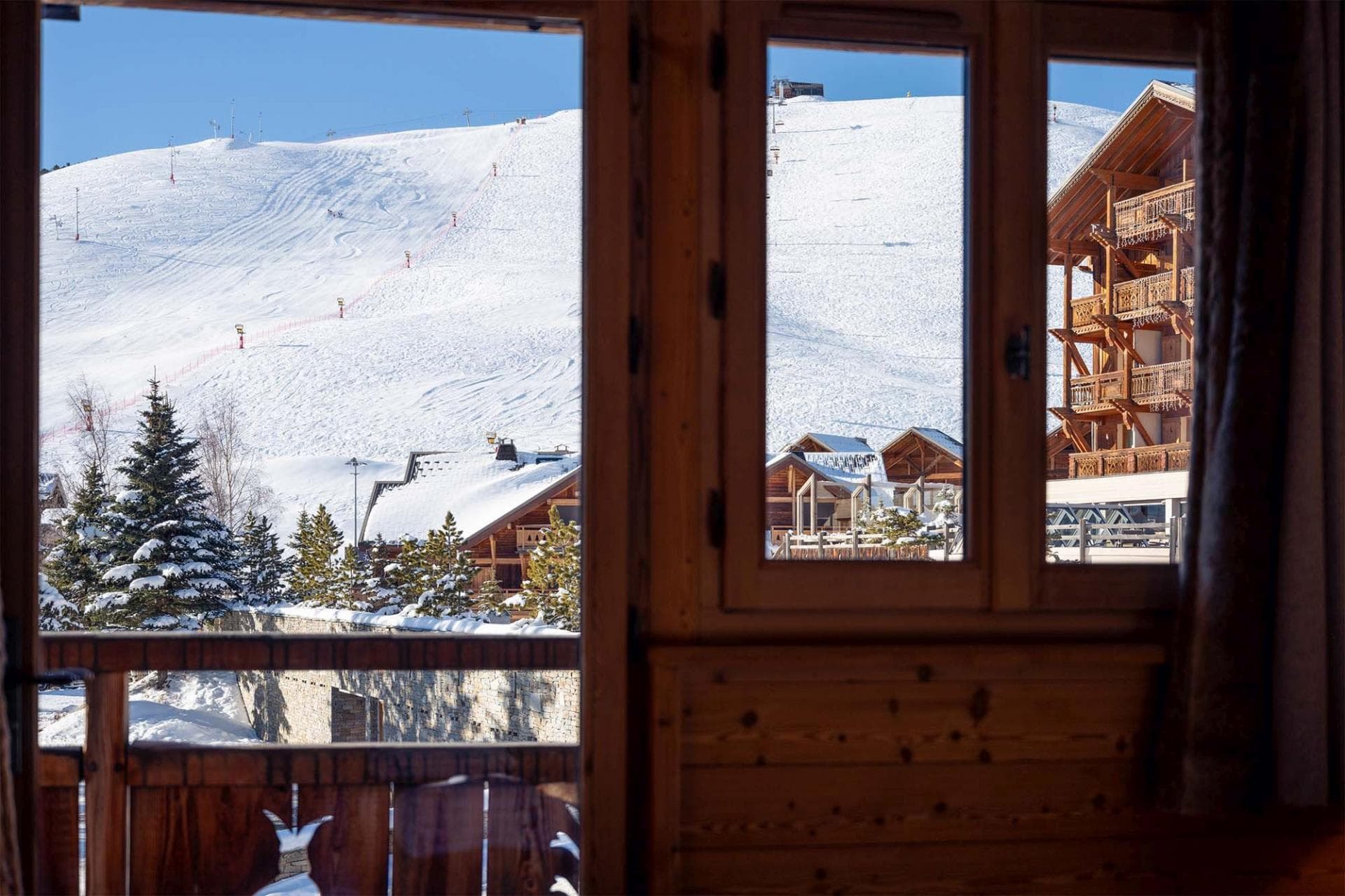 Ski-in/ski-out access; direct views of groomed slopes and lifts