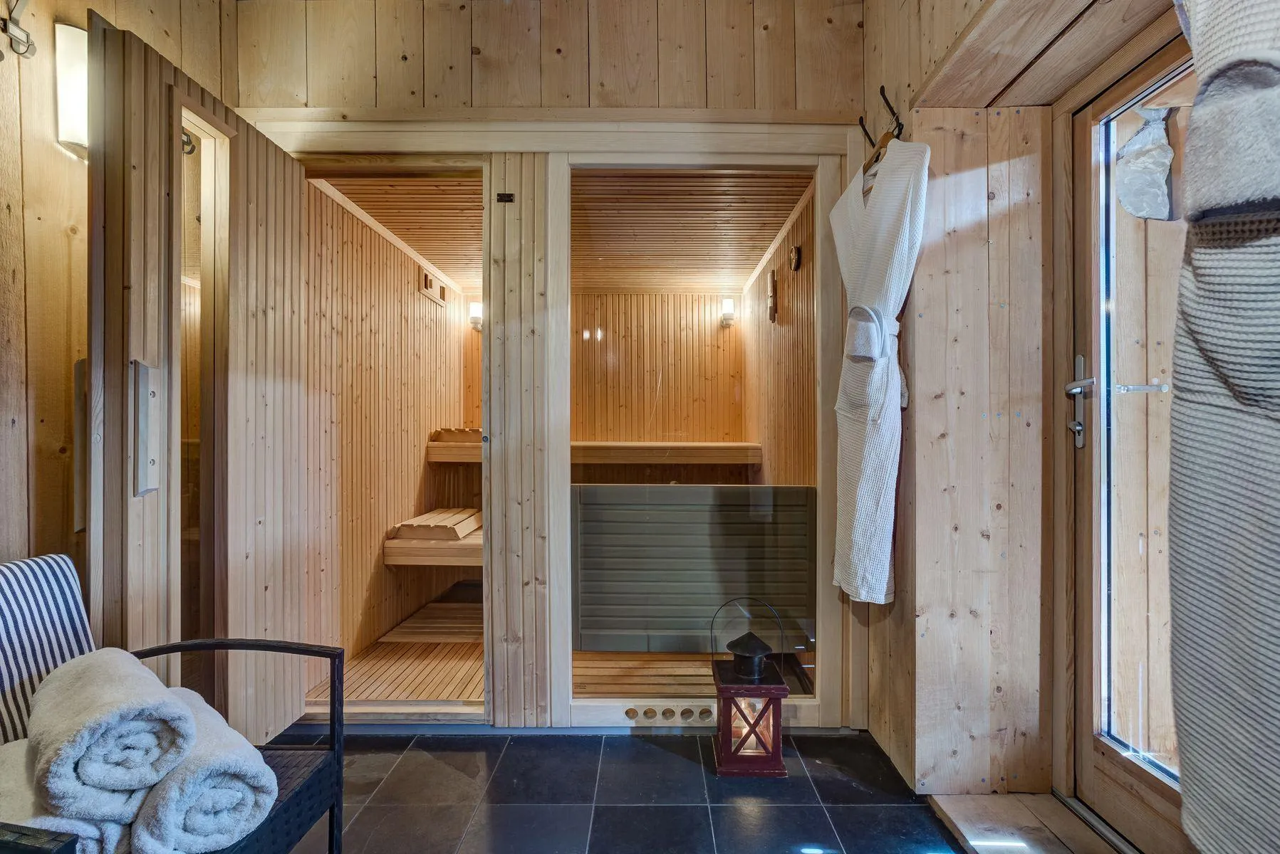 Spa area with two timber-lined wellness cabins