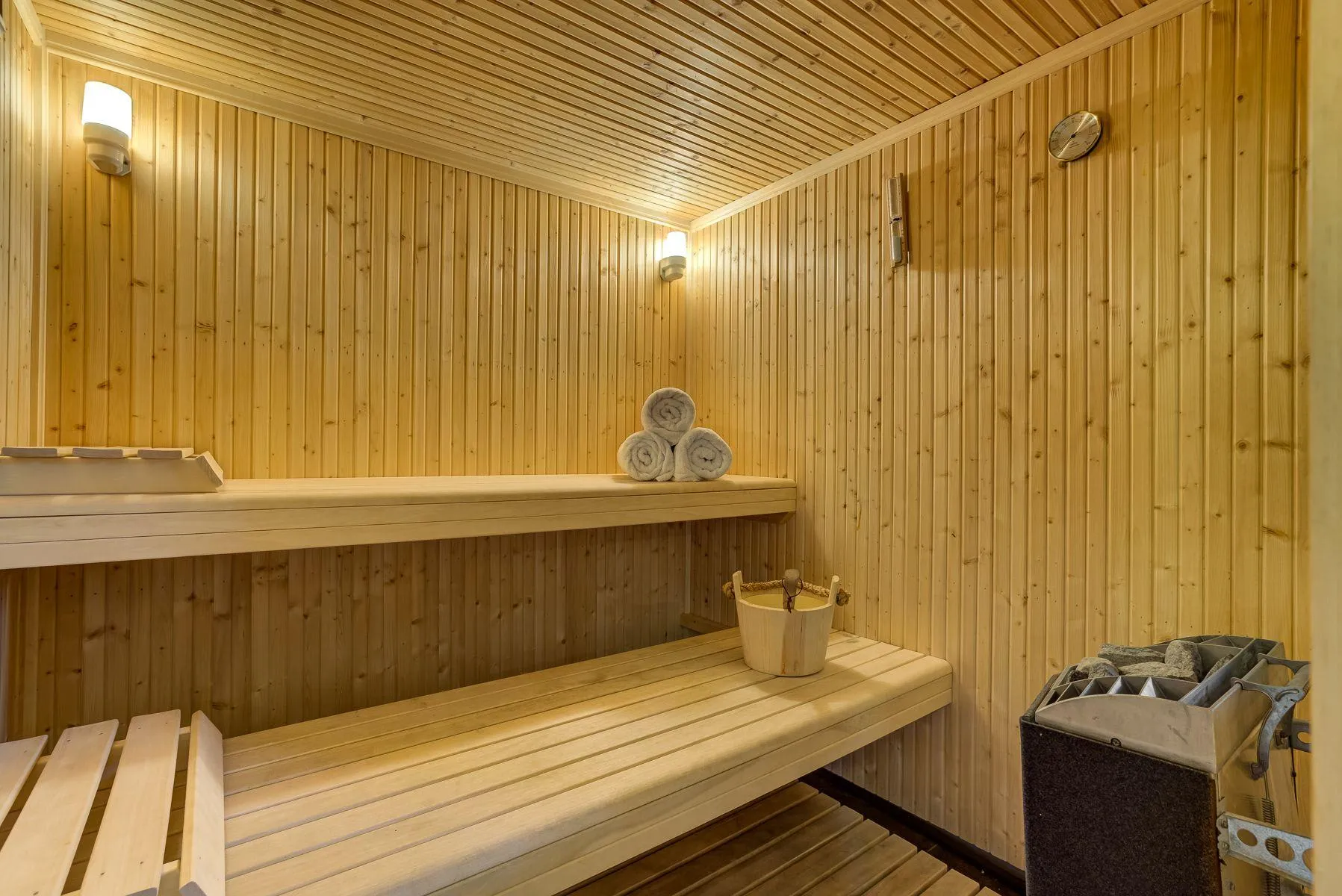 Timber sauna with two tiers of bench seating