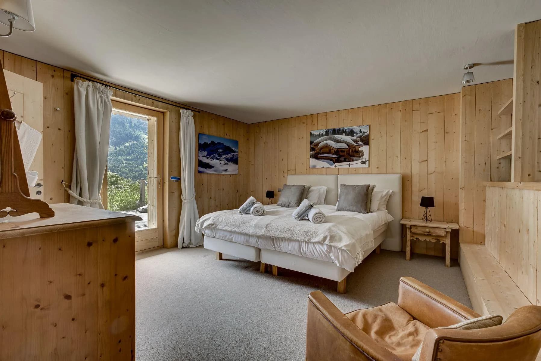 Twin bedroom with timber walls and valley views